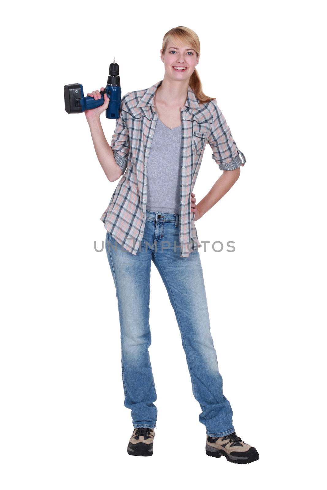 Blond woman stood with power drill