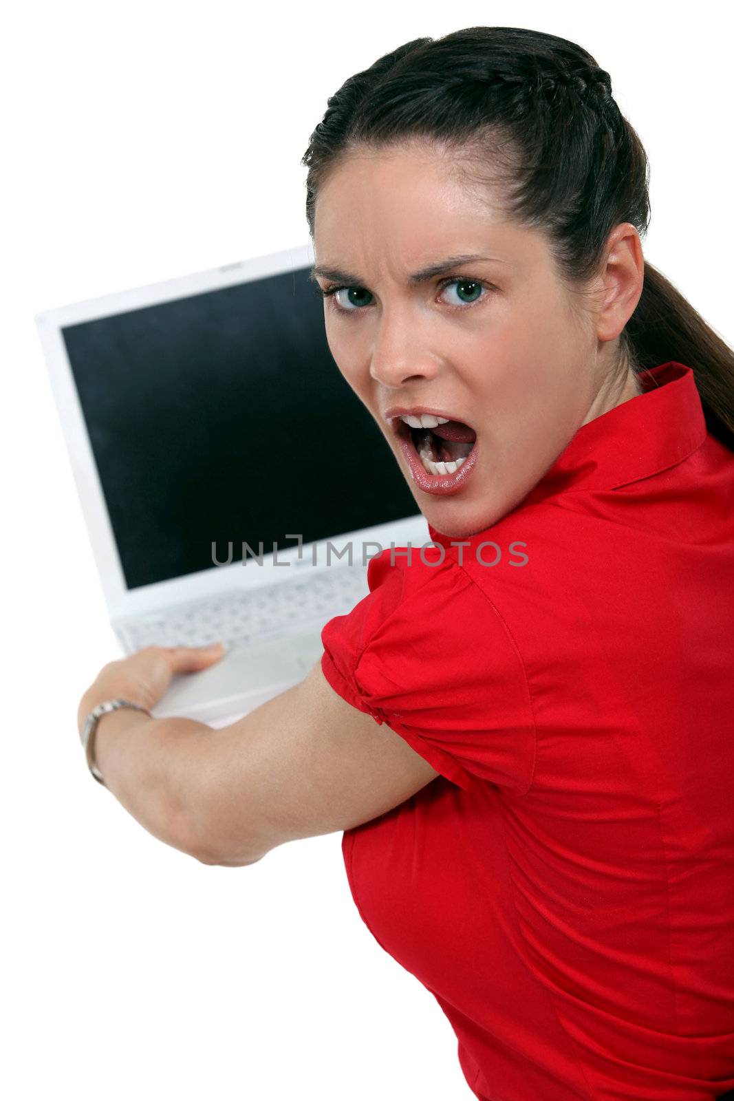 Angry brunette about to smash laptop