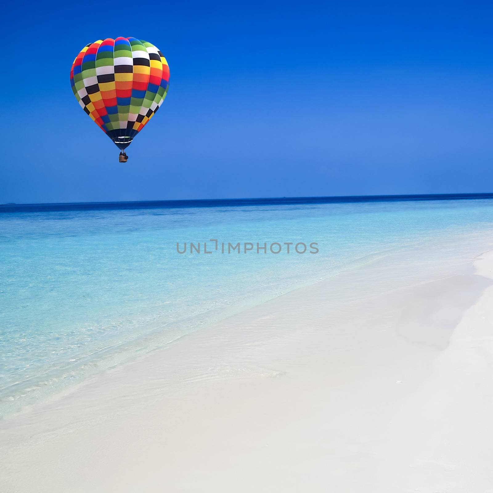 Colorful hot air balloon fly over the blue sea
