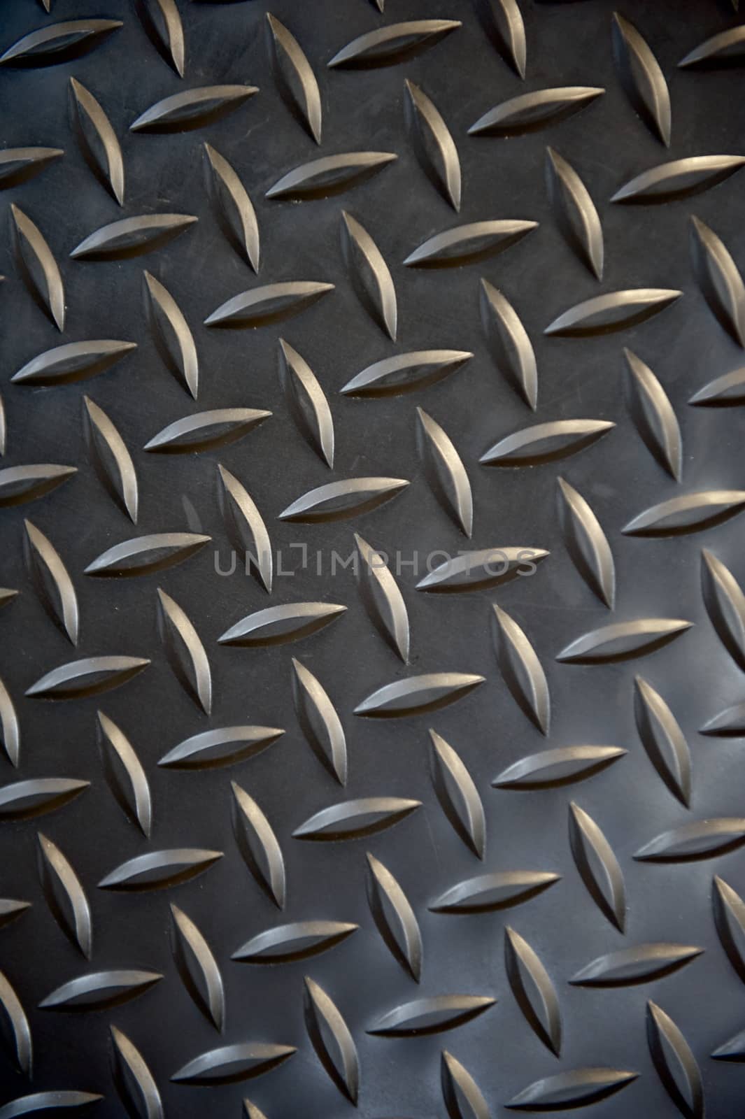 Black non-slip rubber mat with herringbone pattern