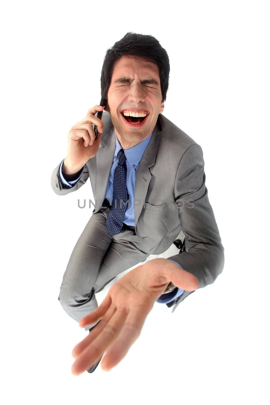 Businessman laughing hysterically by phovoir