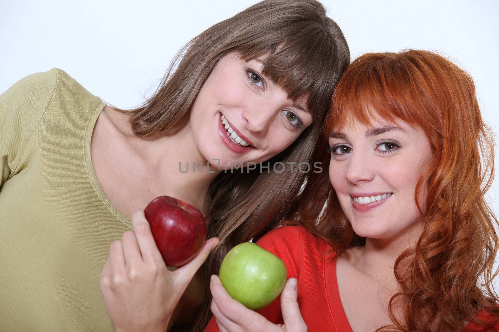 Women holding apples by phovoir