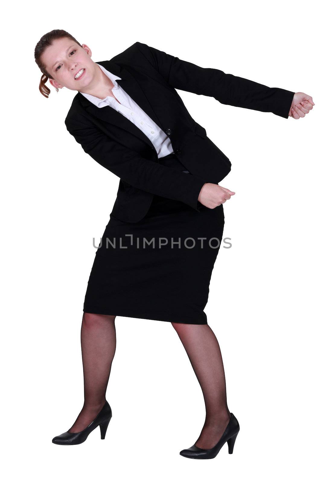 Businesswoman miming that she is pulling something. by phovoir