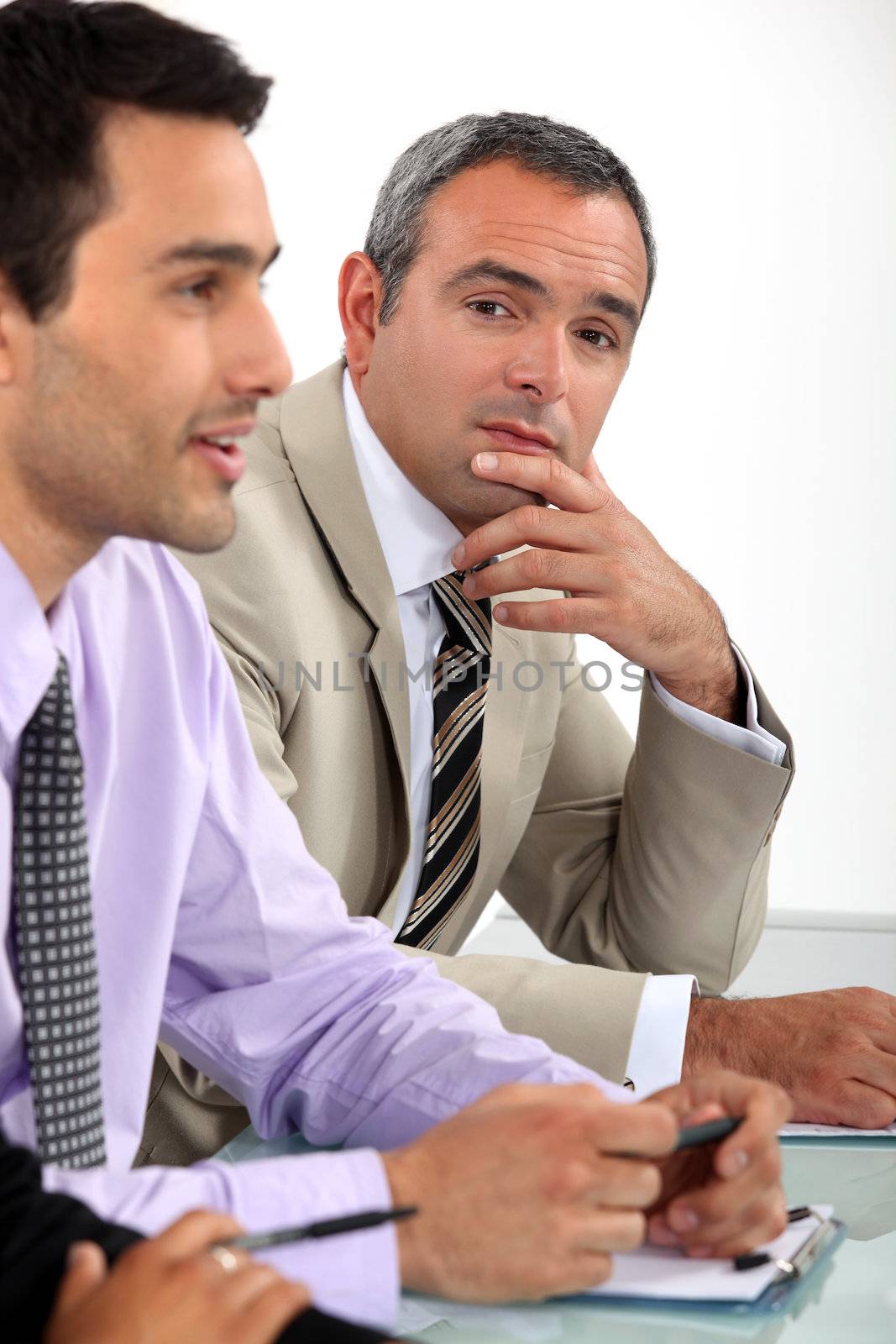Two men sat on interview panel by phovoir