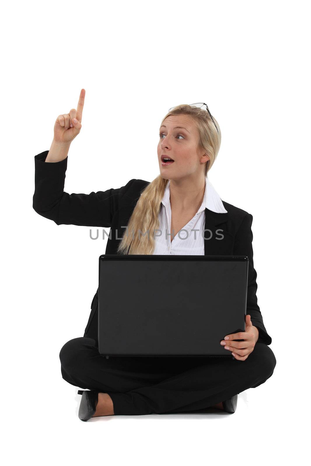Woman with laptop having idea by phovoir