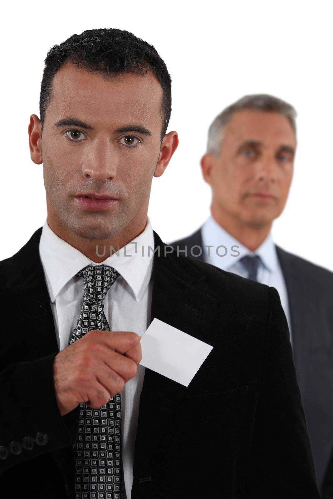 Businessman removing card from pocket by phovoir