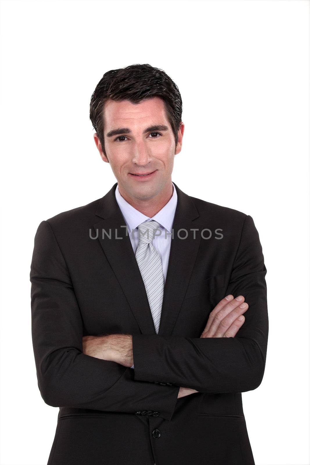 Portrait of a businessman with his arms crossed by phovoir