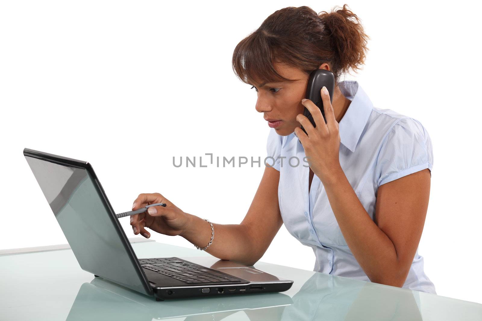 Woman telephoning technical help desk by phovoir