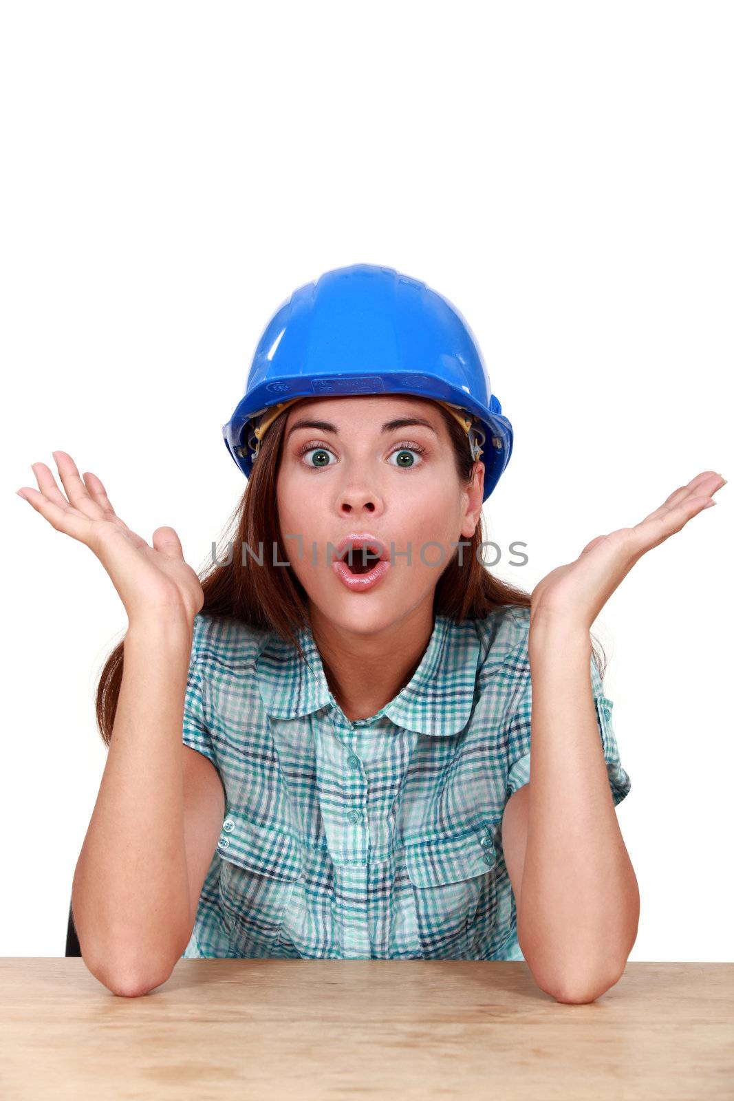 Surprised female construction worker