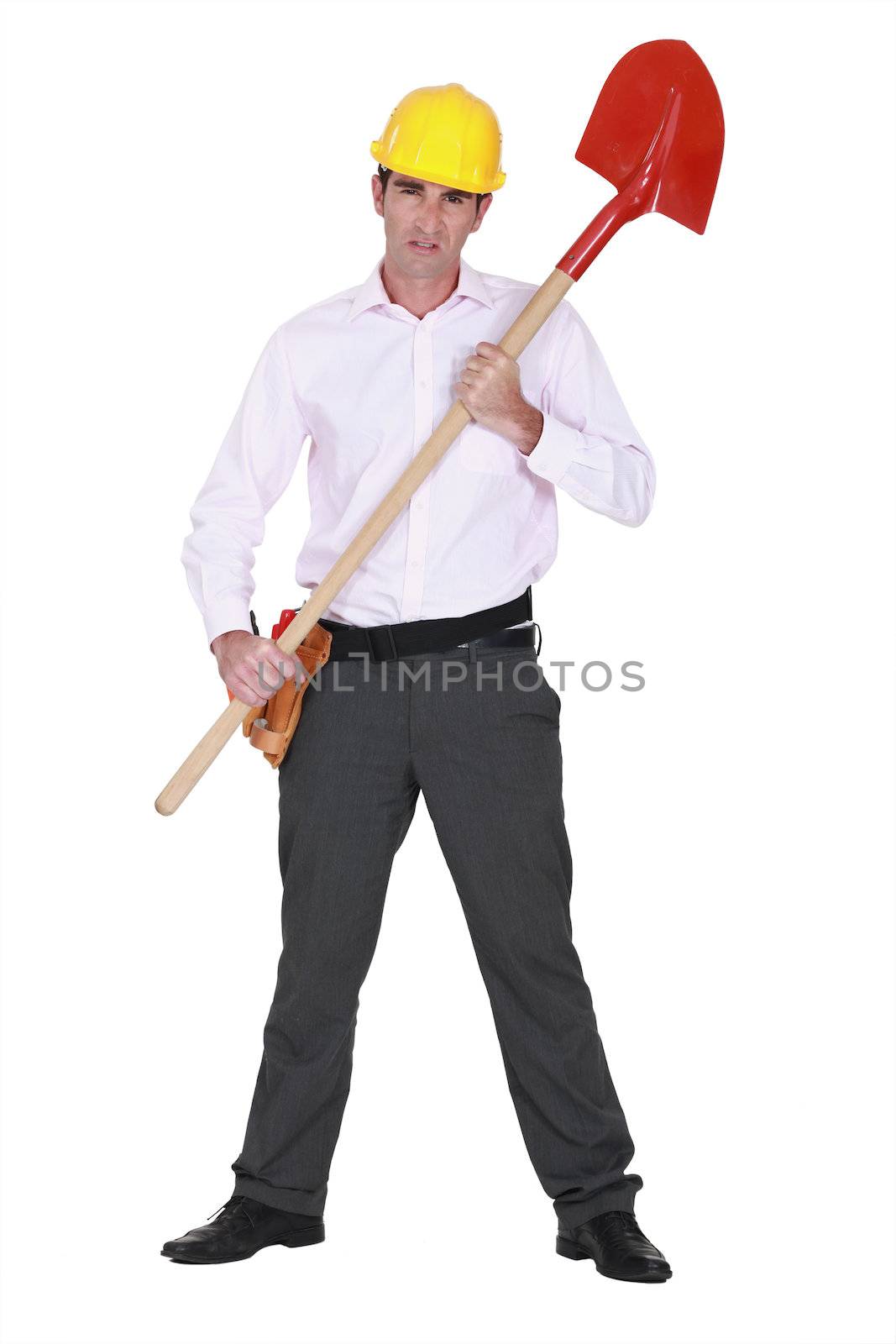 Businessman with a hardhat and shovel