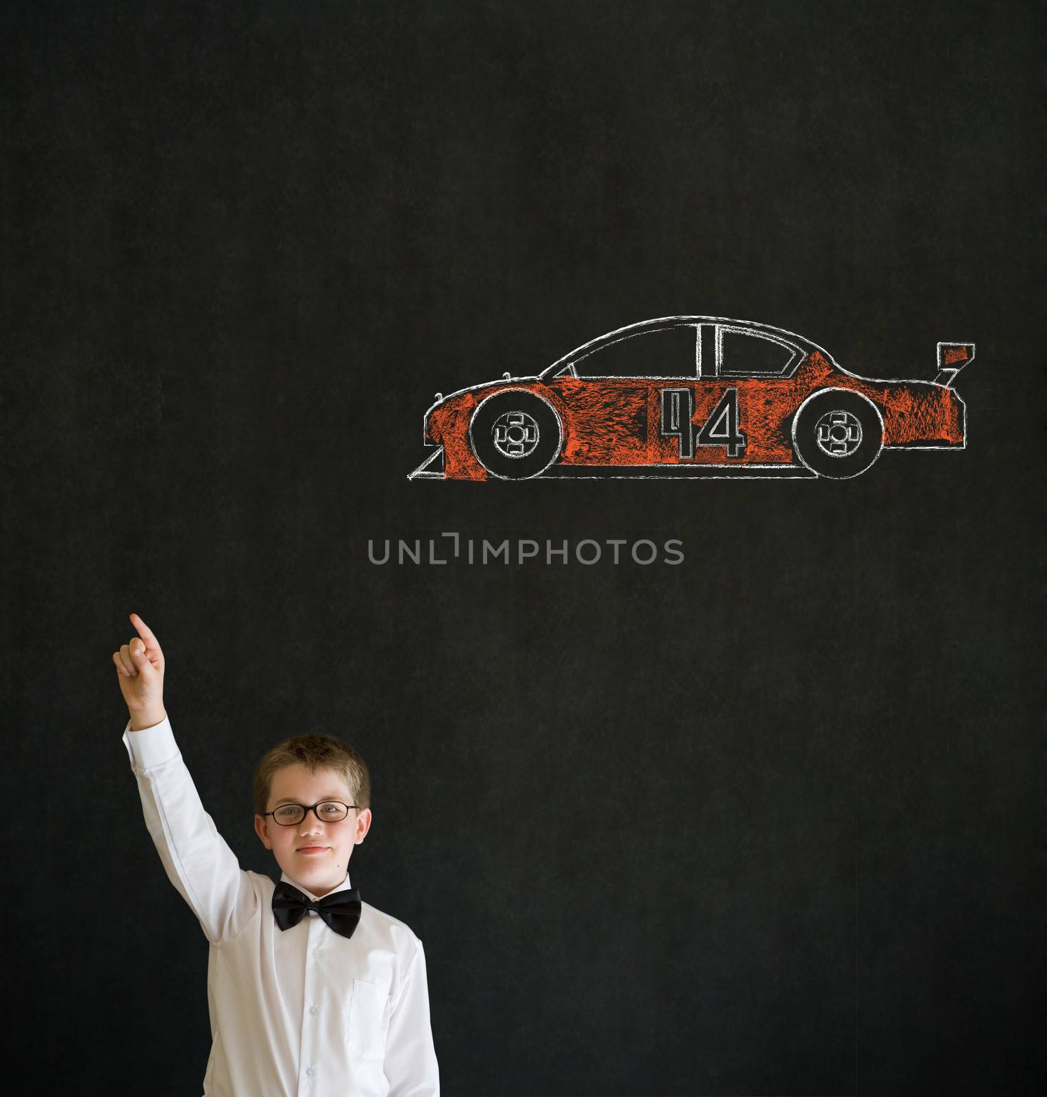 Hand up answer boy dressed up as business man with Nascar racing fan car on blackboard background