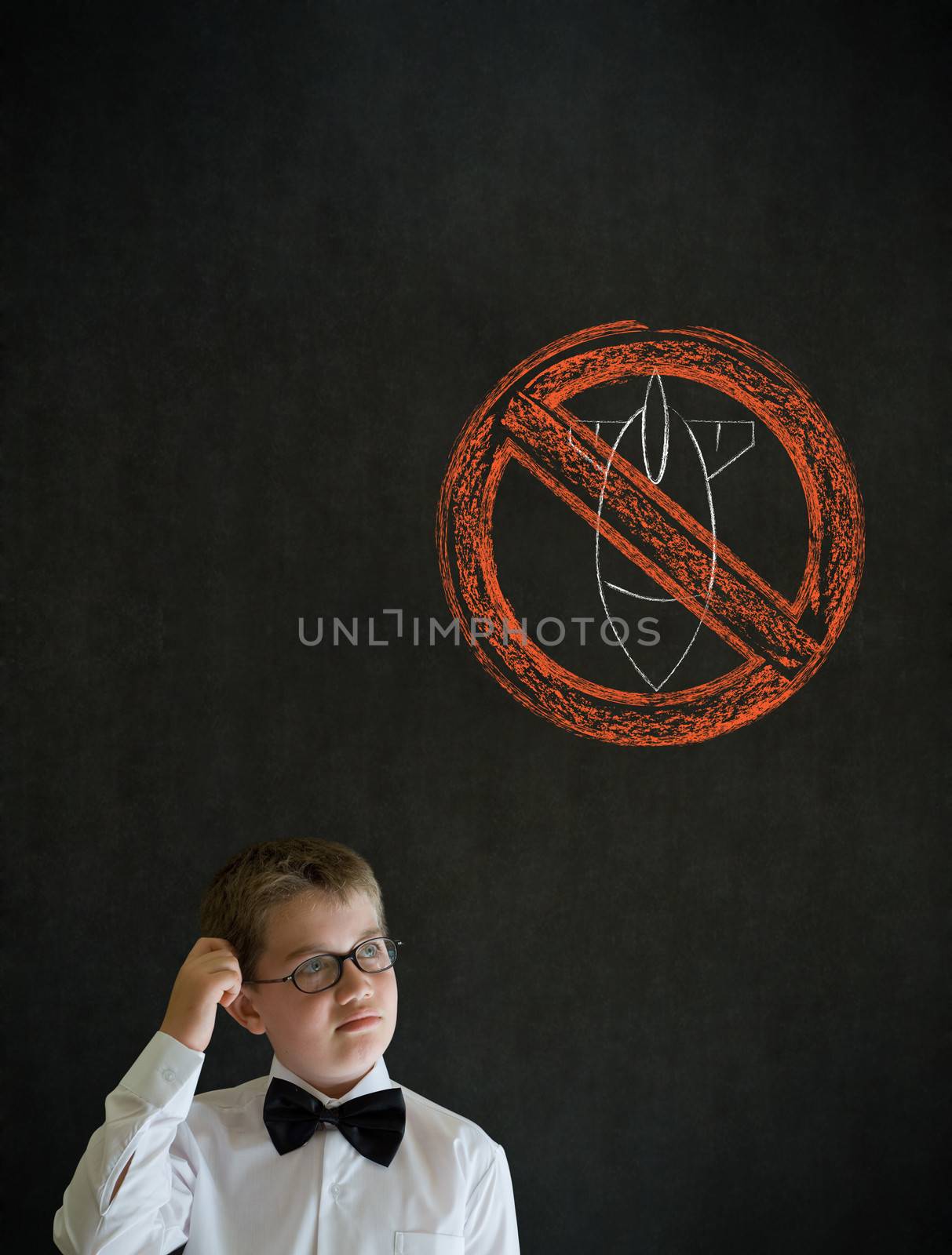Scratching head thinking boy dressed up as business man with politician no bombs war pacifist sign on blackboard background