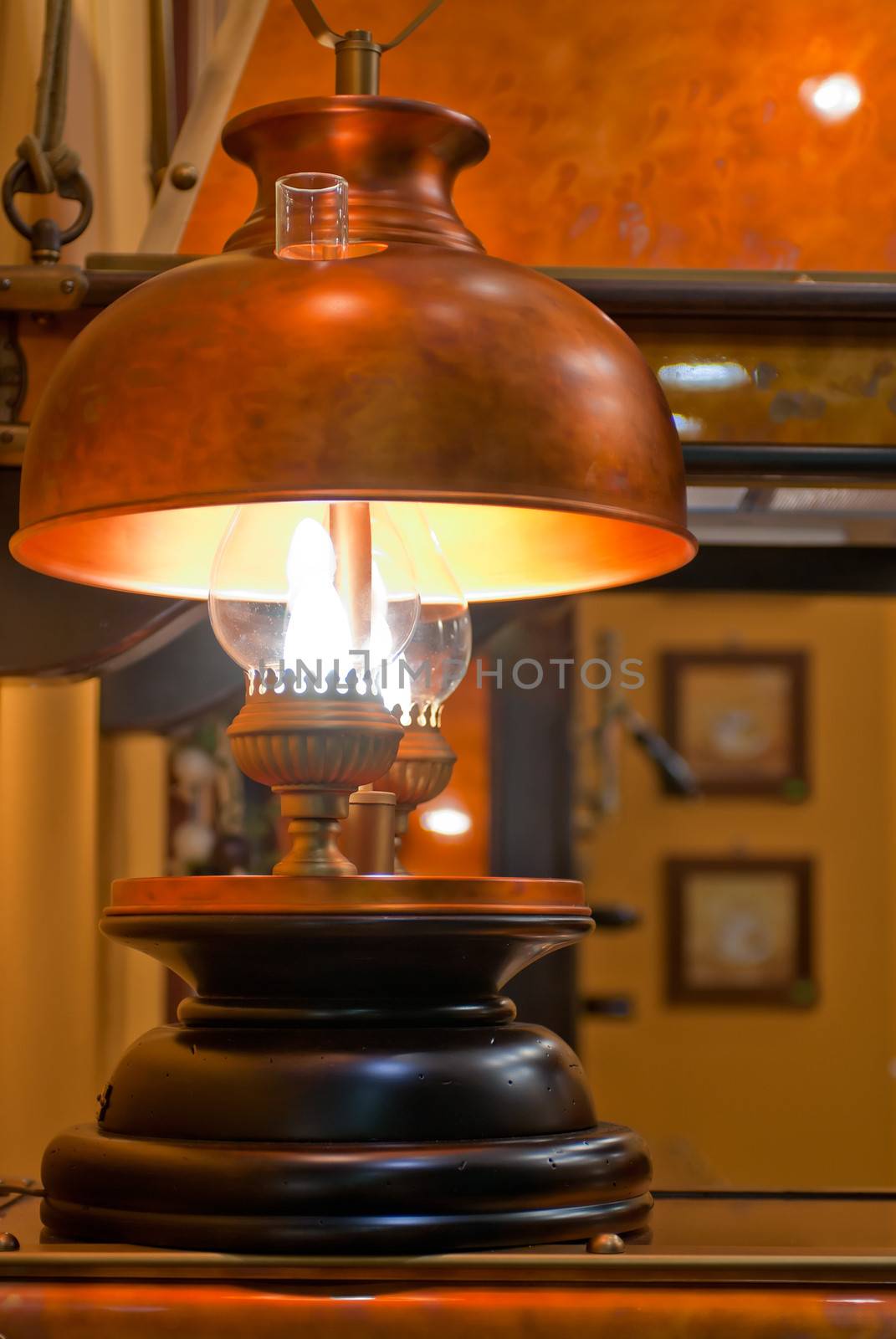 Old kerosene lamp with copper shade