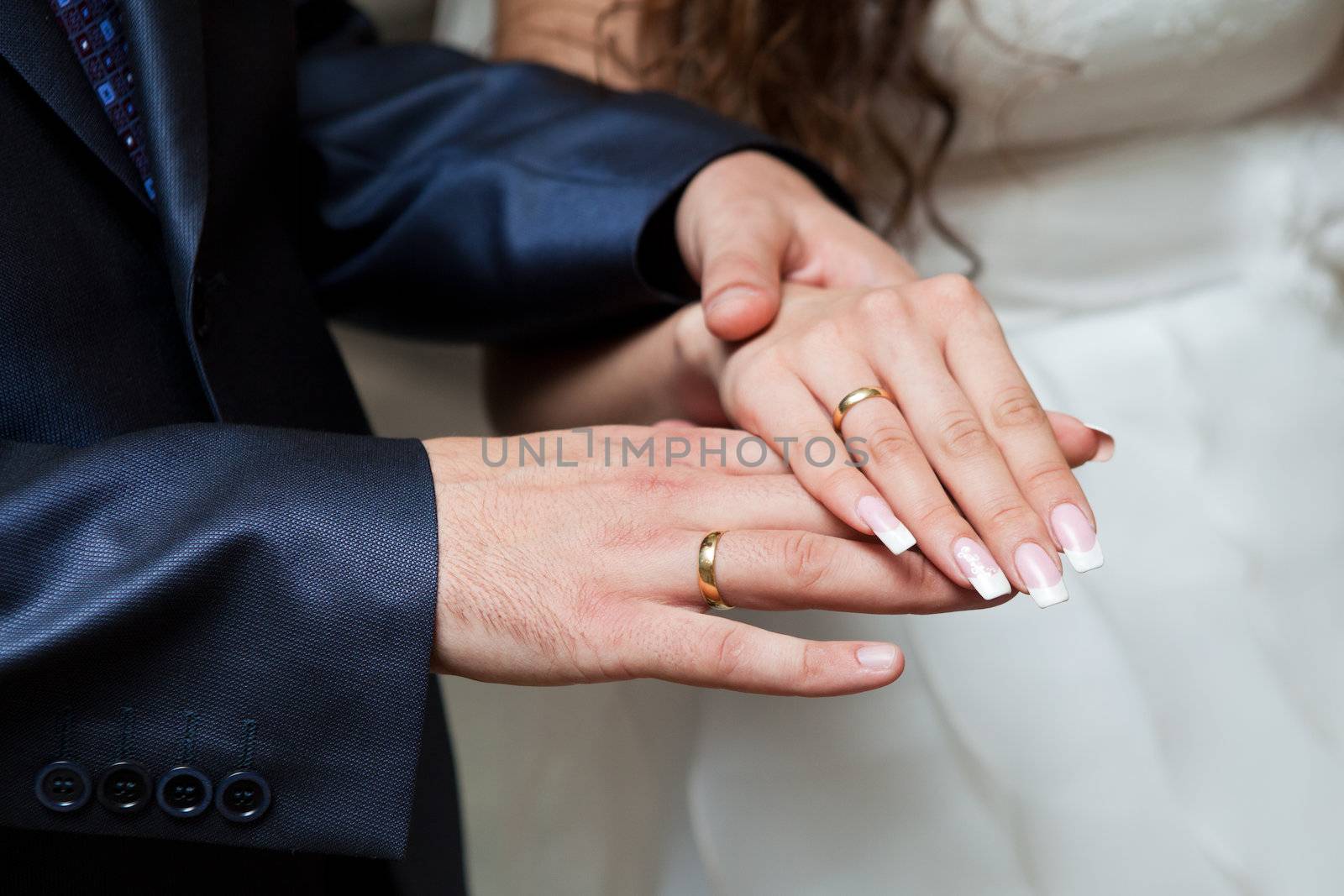 hands with wedding rings by vsurkov