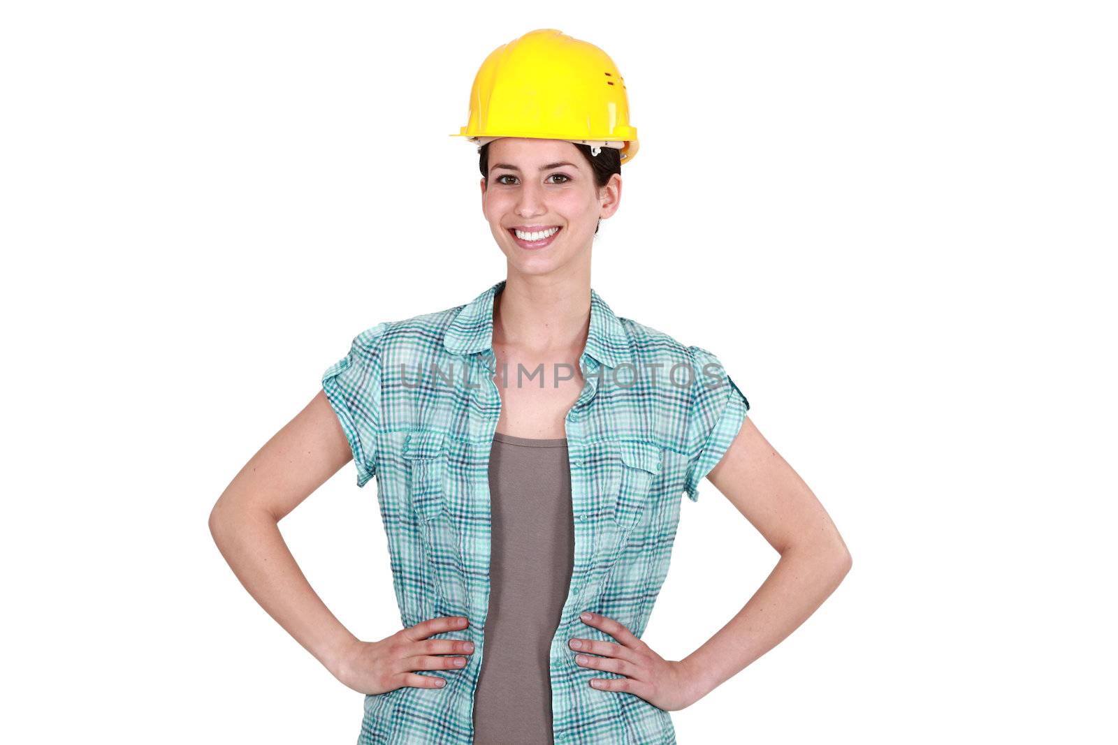 Confident female builder by phovoir