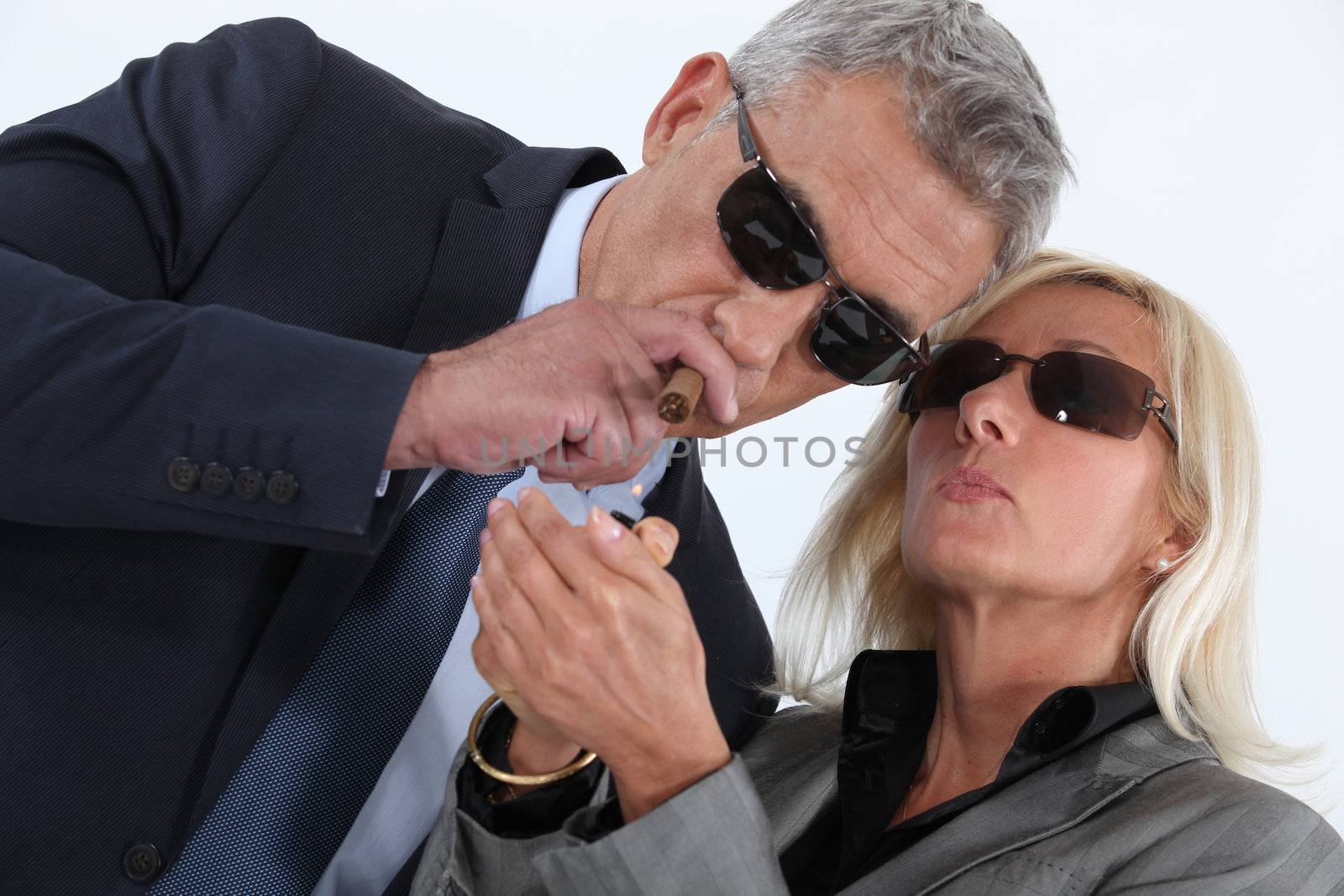 mature gentleman smoking cigar with blonde spouse showing off by phovoir
