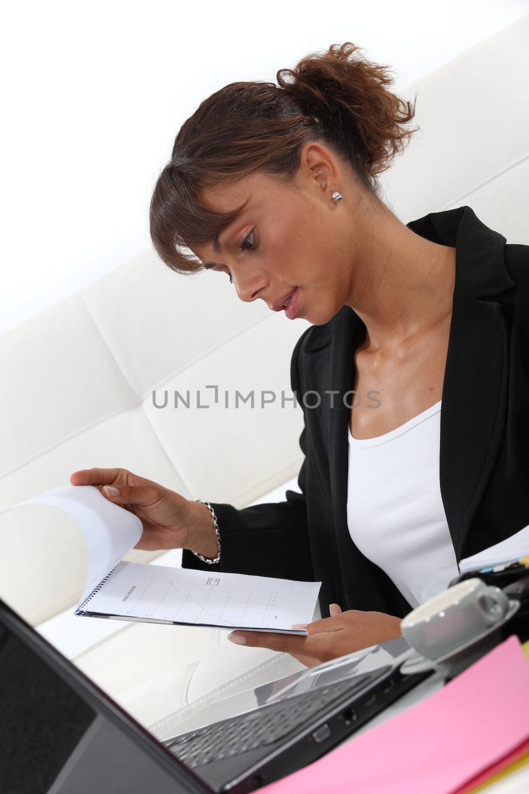 Businesswoman looking at a notepad