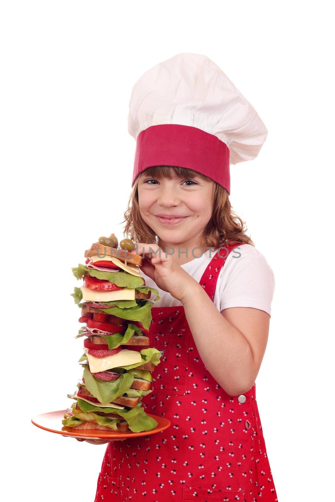 happy little girl cook hold tall sandwich