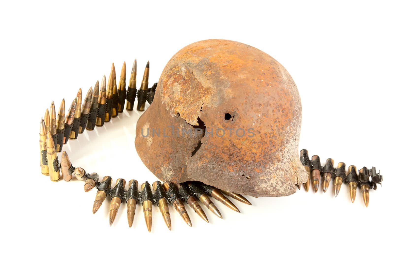 The rusty raked helmet and machine-gun tape on a white background