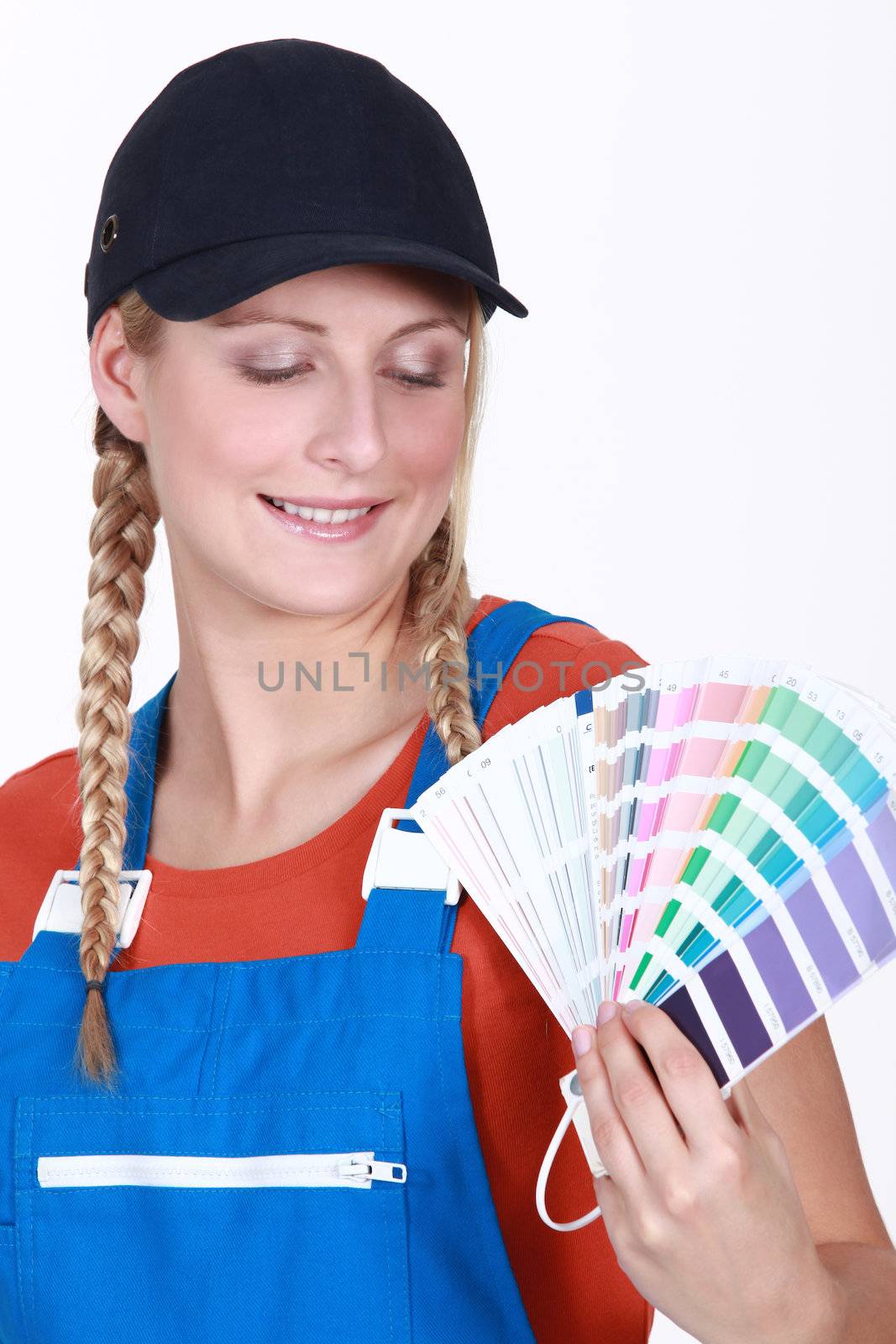 Woman choosing which color paint to use