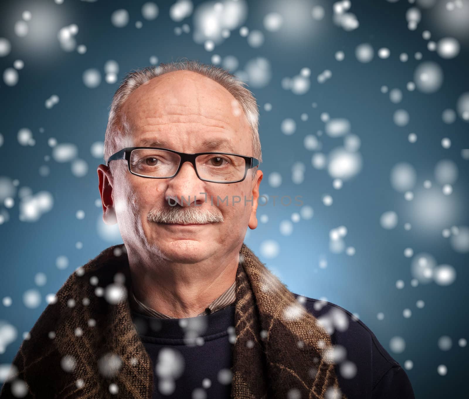 winter concept -  elderly man looks skeptically by palinchak