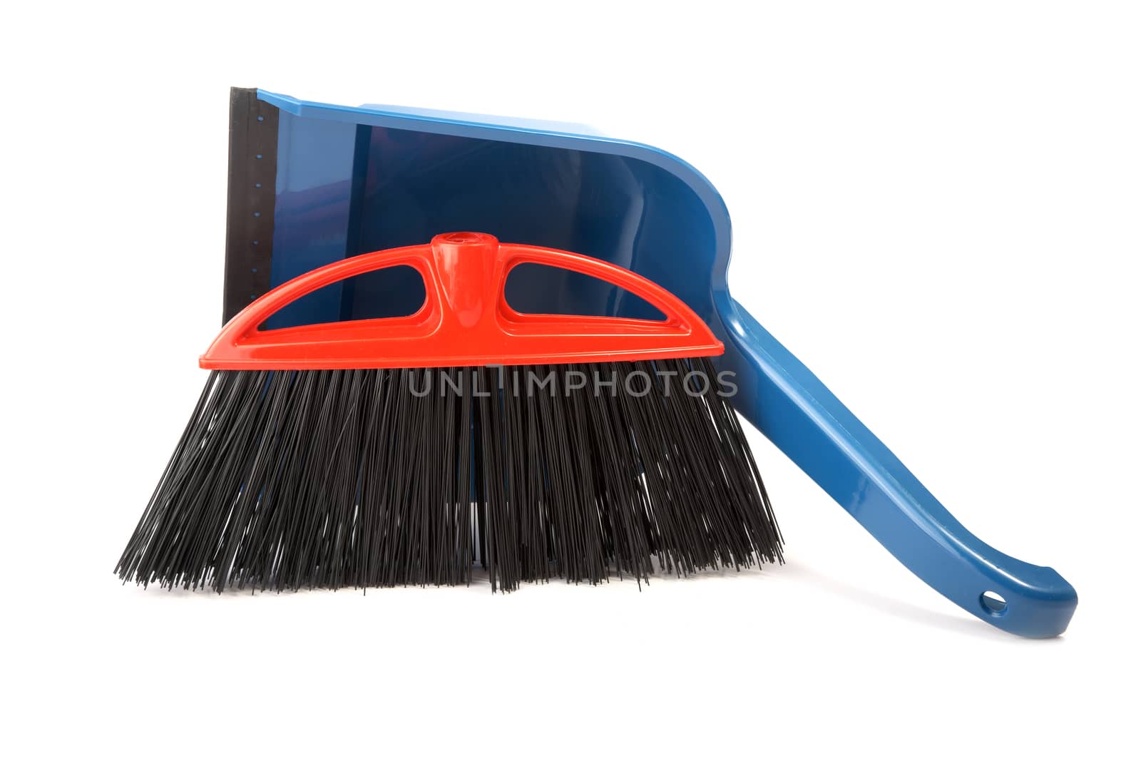 Scoop for dust and  brush on a white background