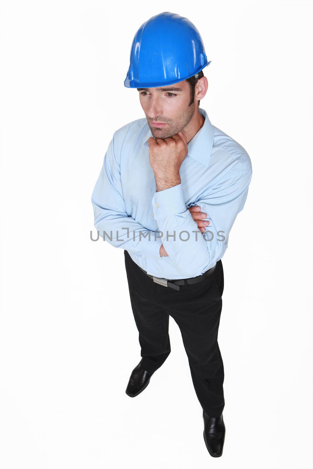 businessman wearing helmet and thinking by phovoir