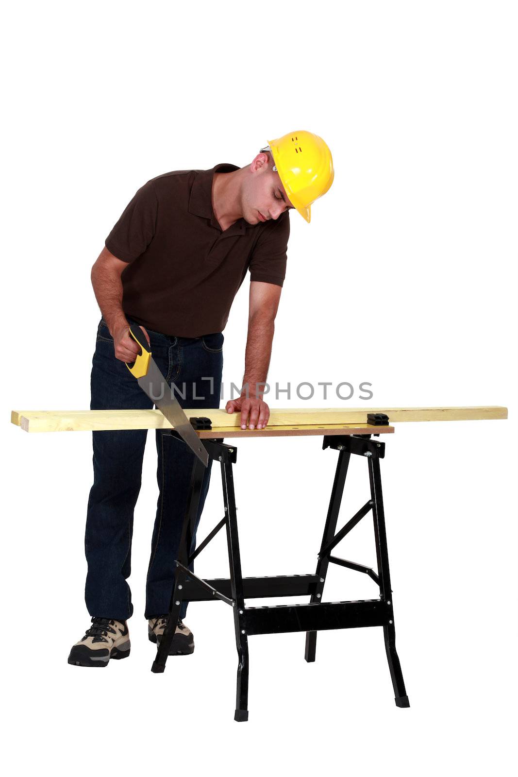 craftsman cutting a board by phovoir