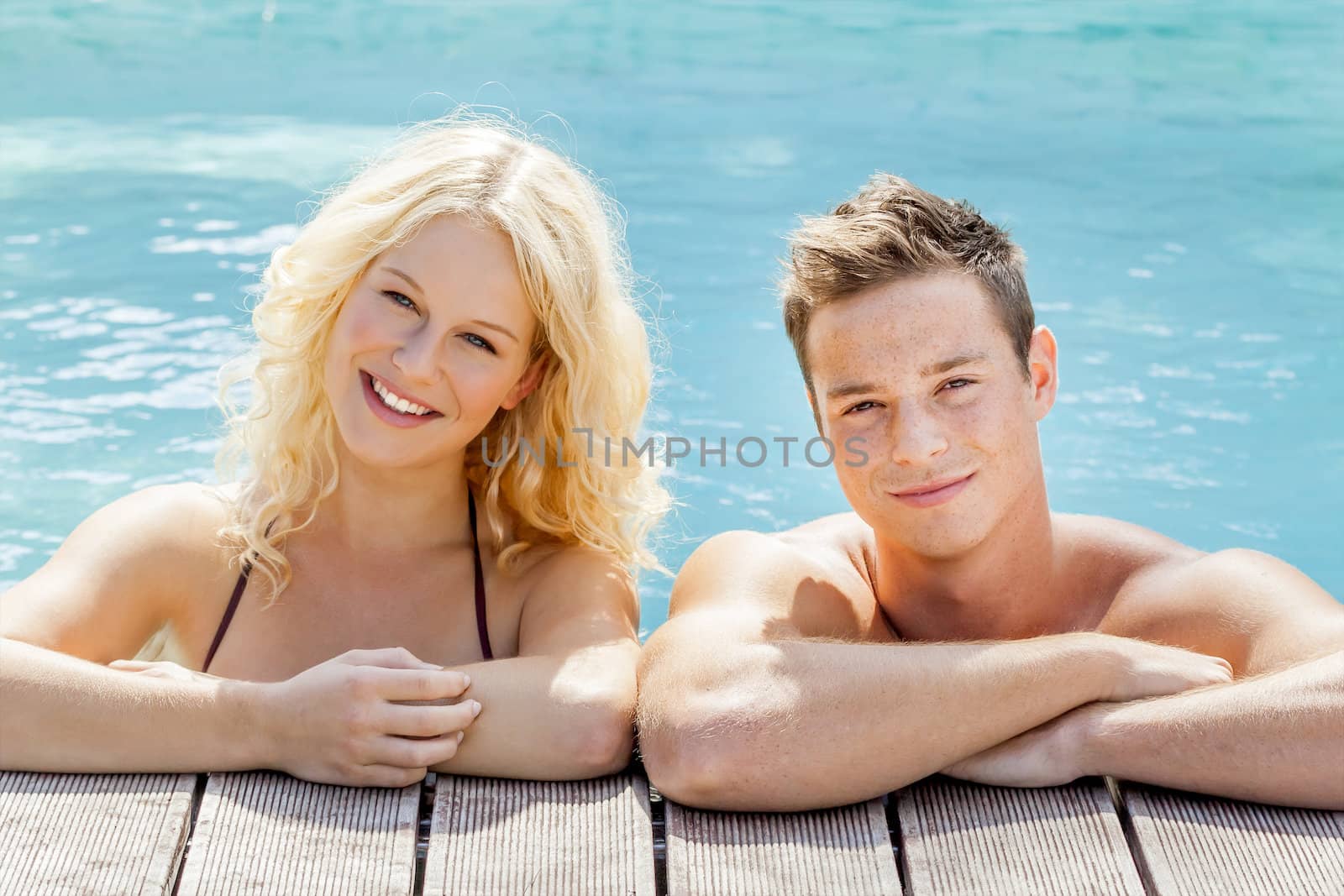 young couple at the pool by magann