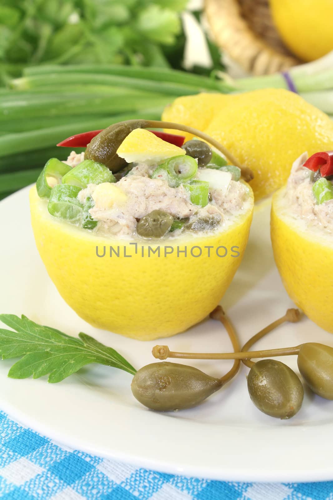 stuffed Lemons with tuna cream on a light background