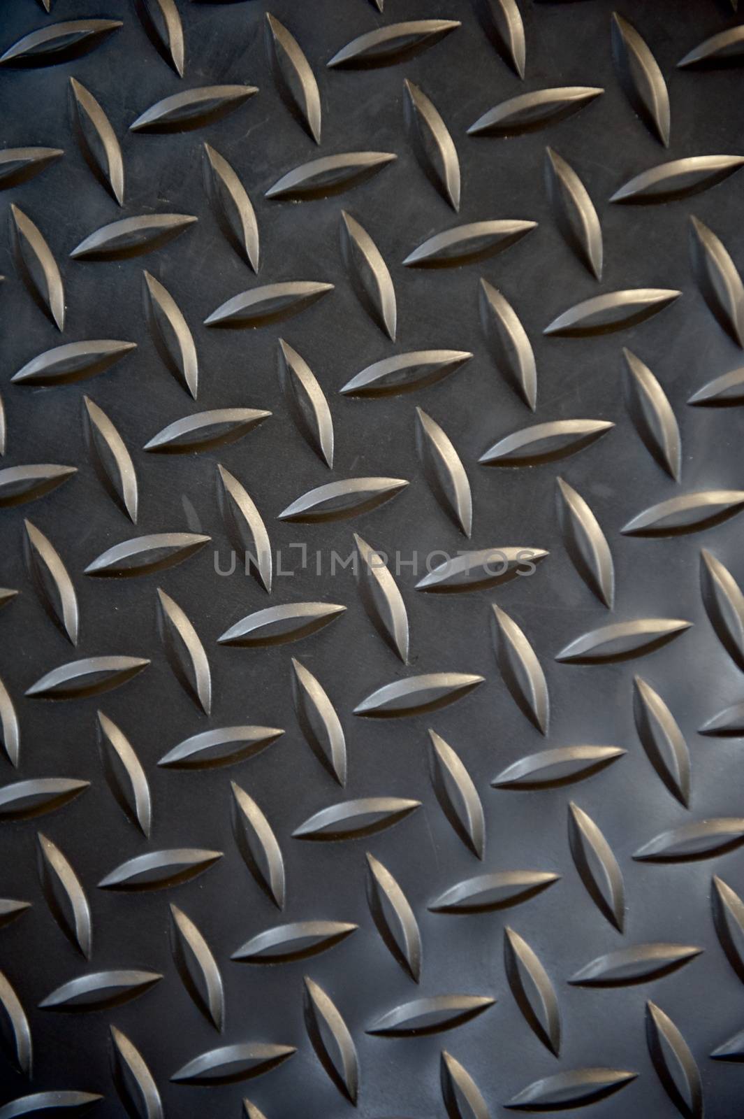 Black non-slip rubber mat with herringbone pattern