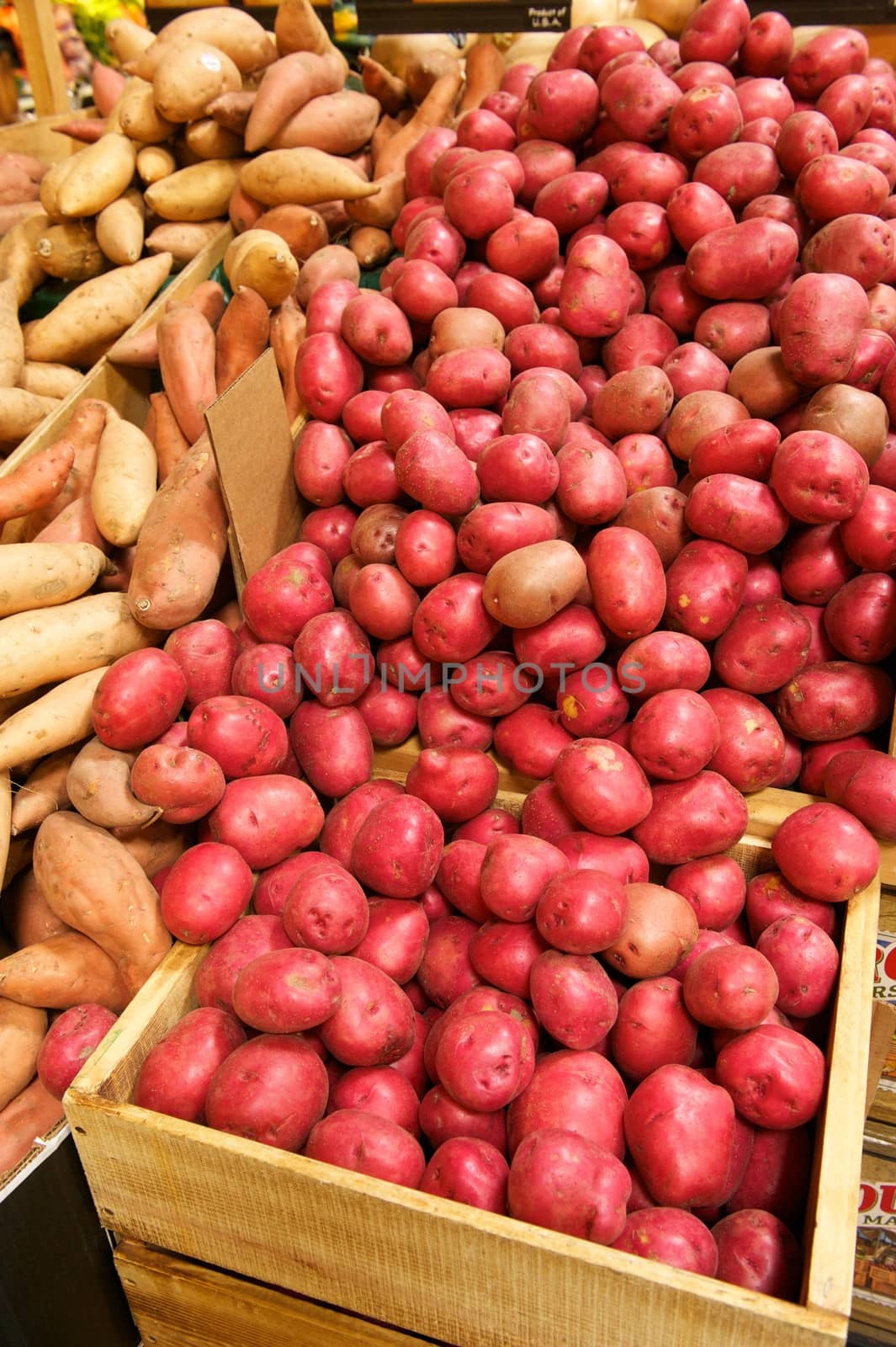 Wooden crate full of fresh and clean red Russet potatoes