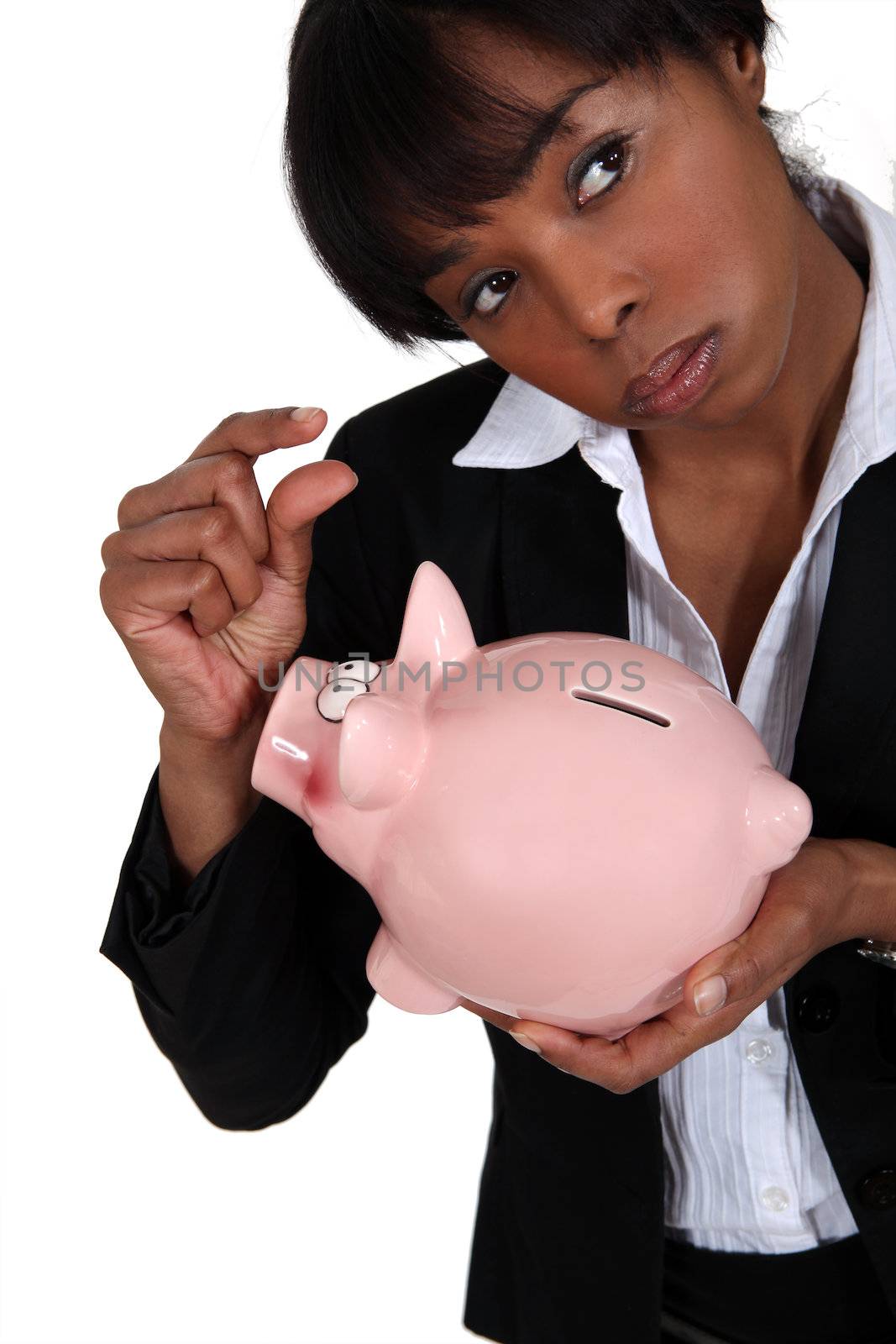 Businesswoman holding a piggy bank. by phovoir
