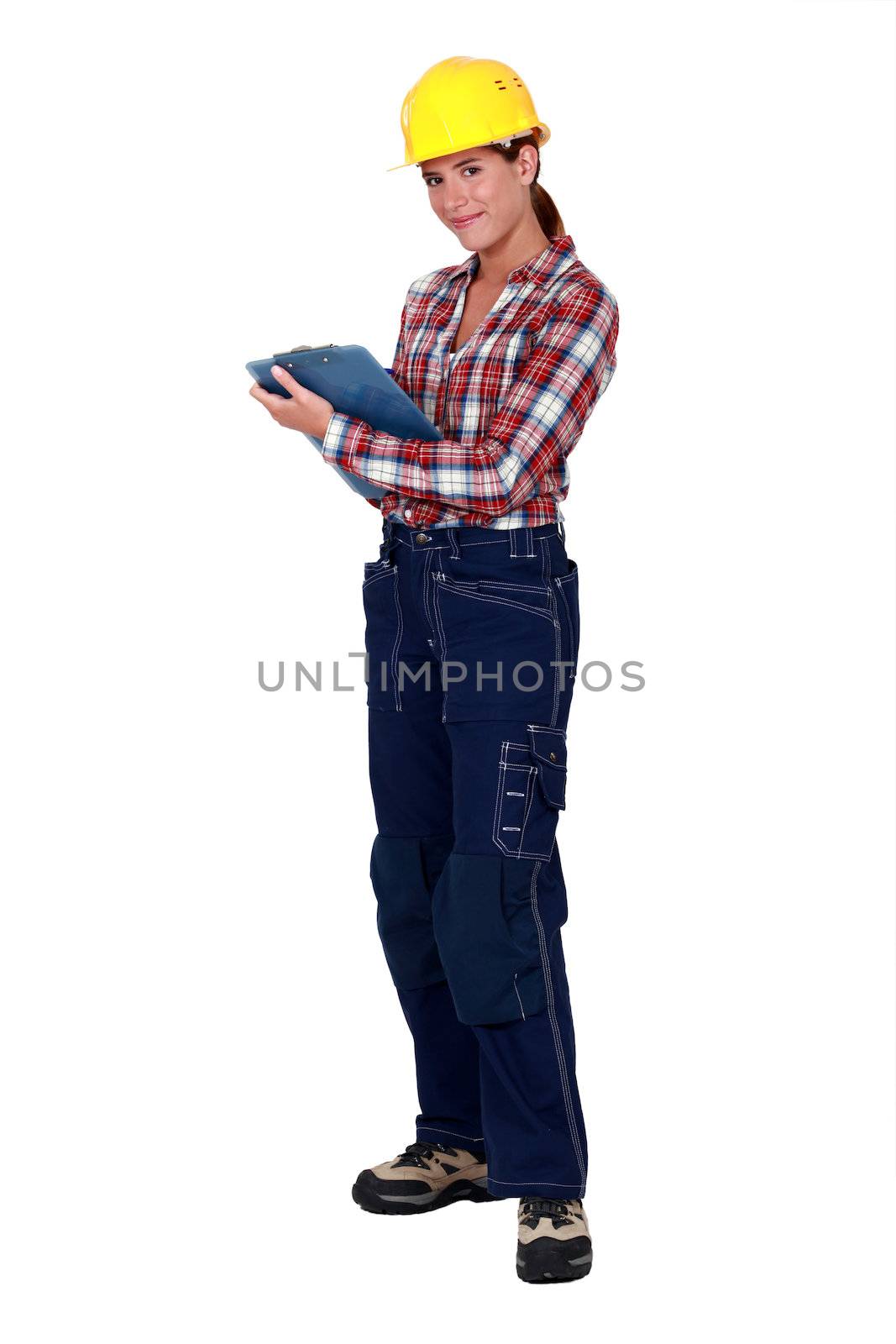 Tradeswoman holding a clipboard by phovoir