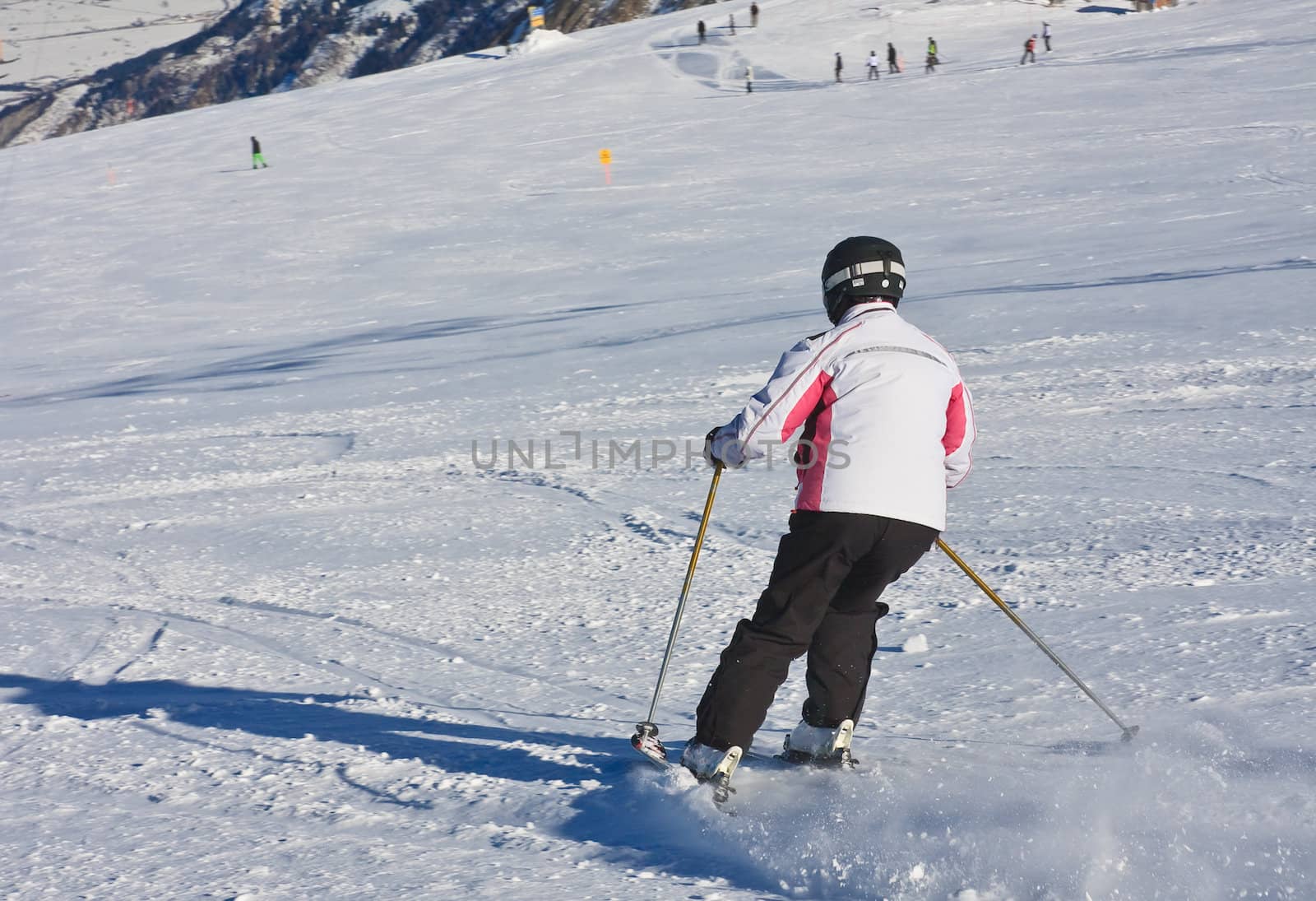 A woman is skiing at a ski resort by nikolpetr
