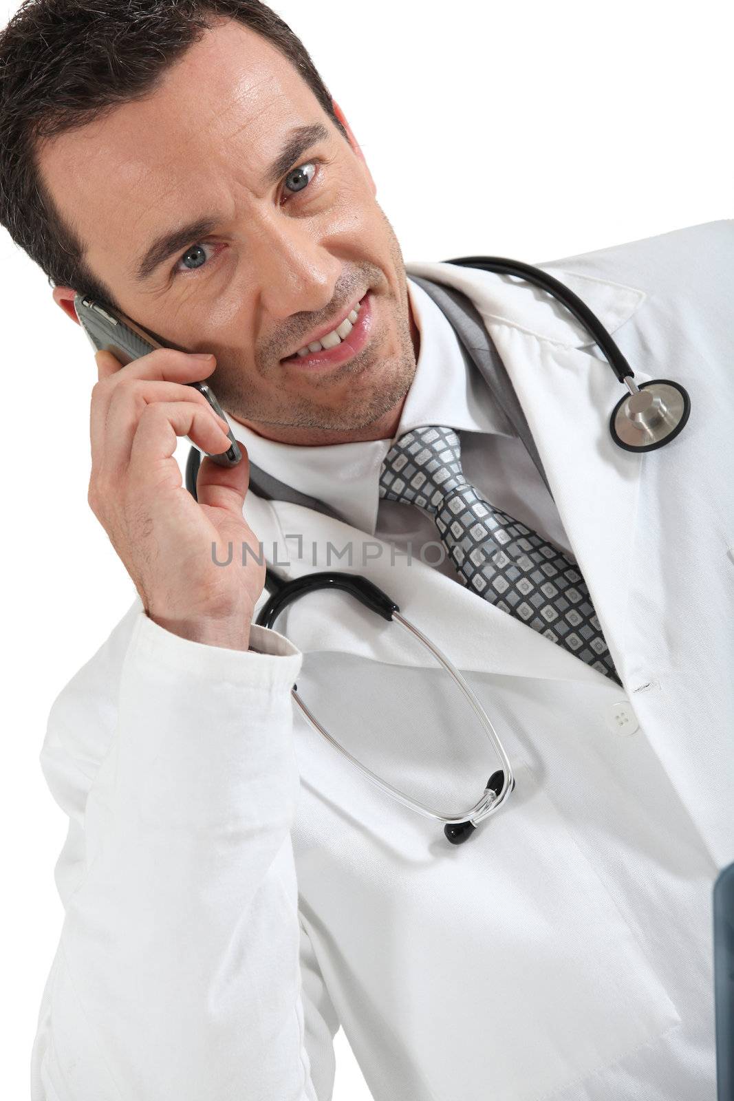 Male doctor with mobile telephone