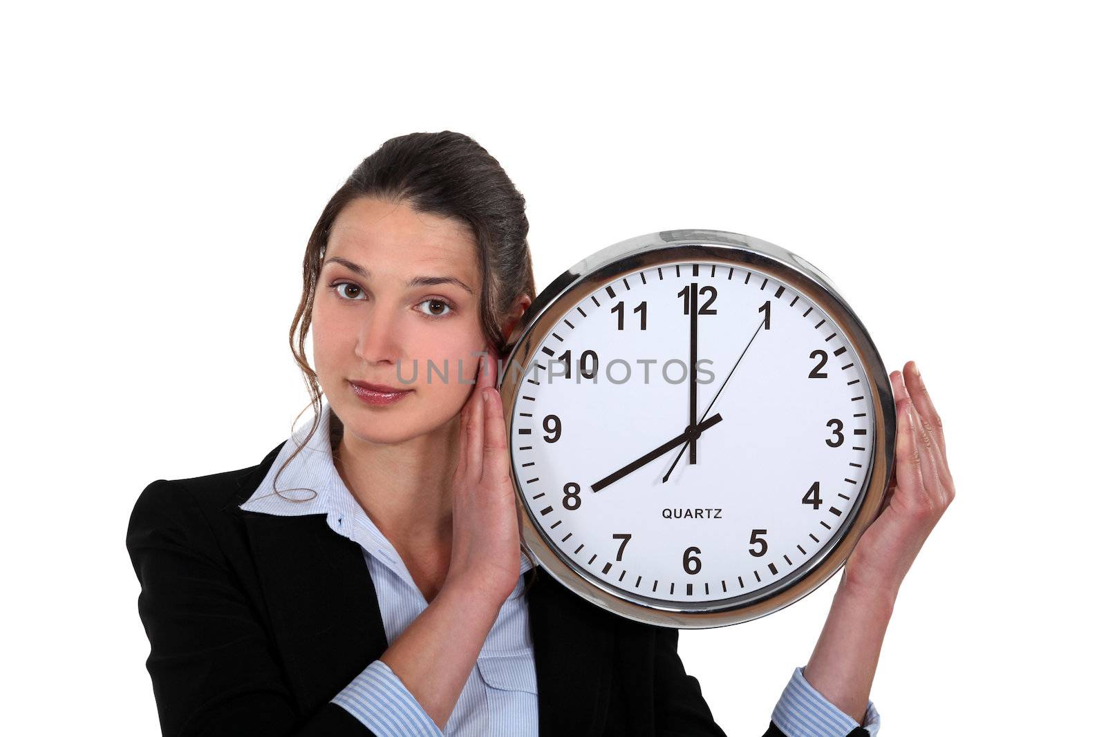 Woman holding clock by phovoir