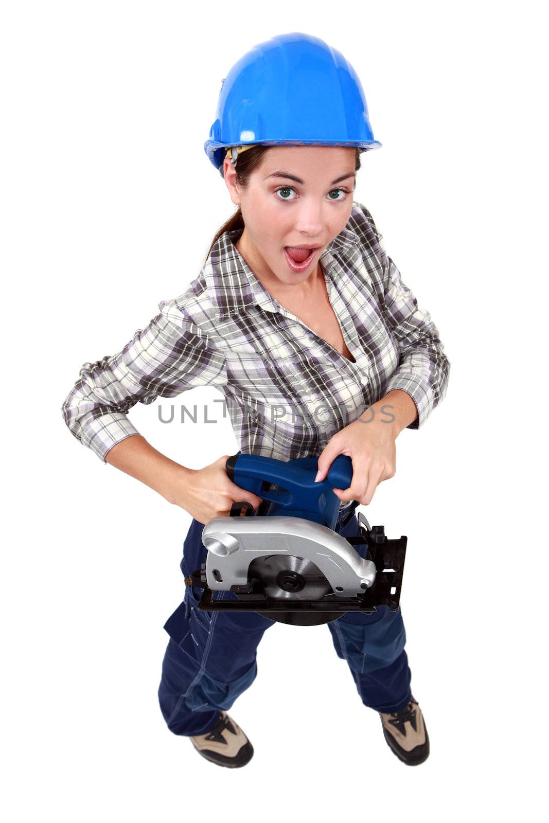 A female carpenter with a circular saw.