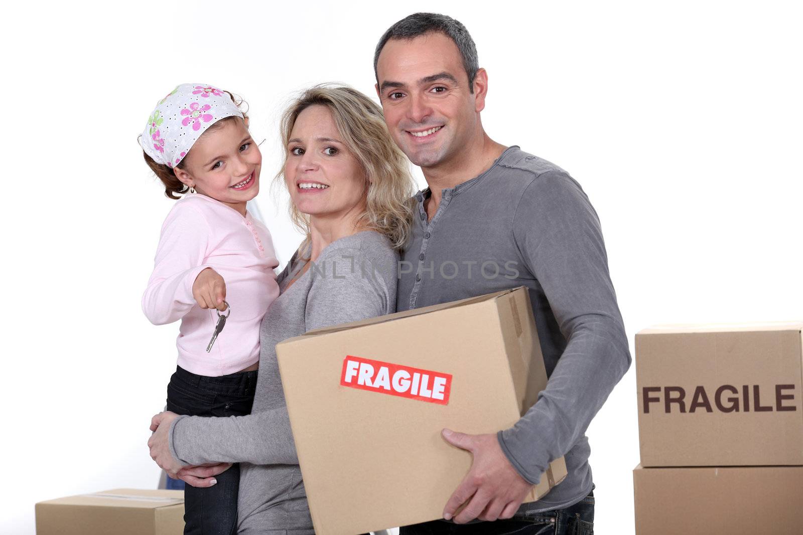 Young family moving house by phovoir