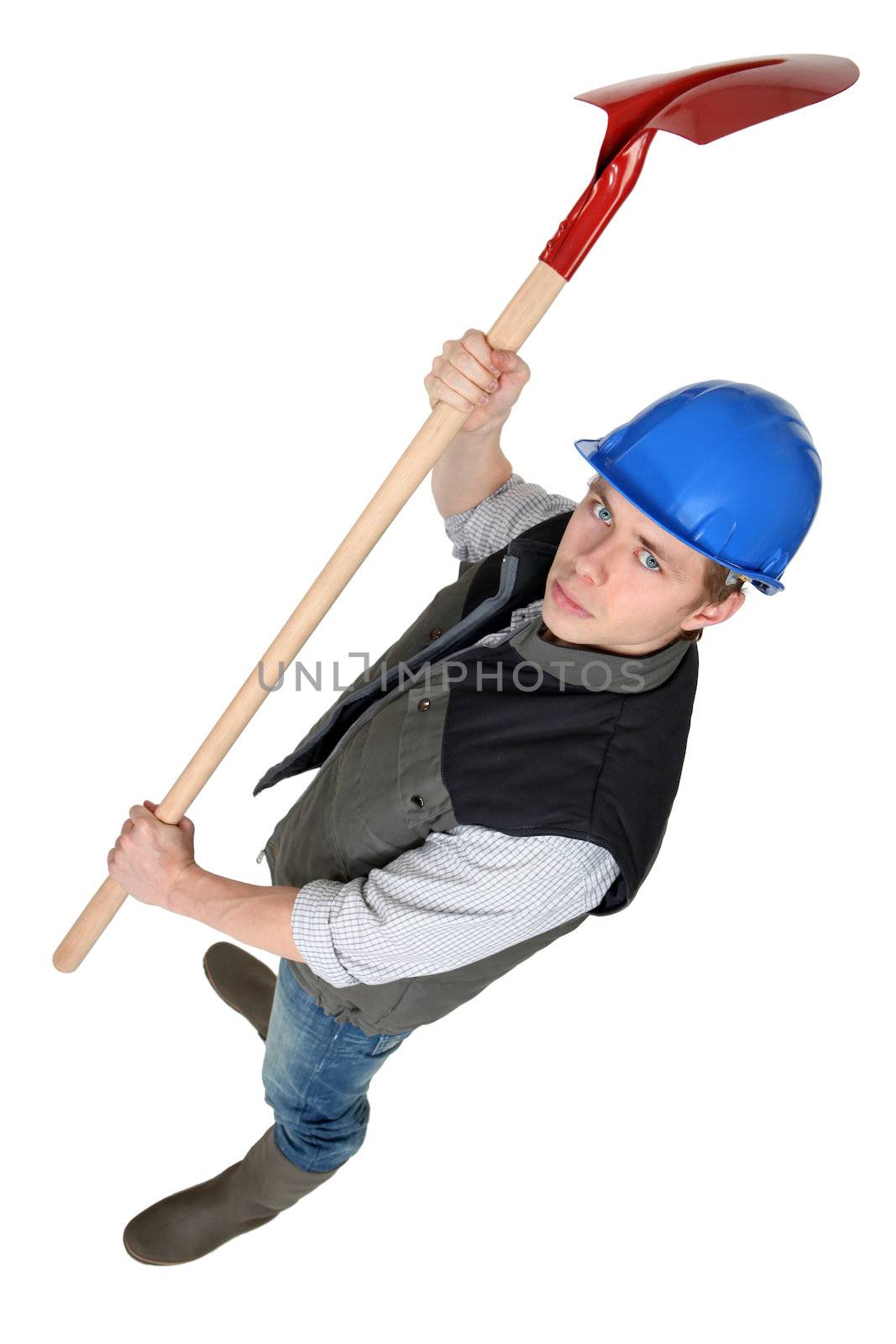 Worker raising spade in the air
