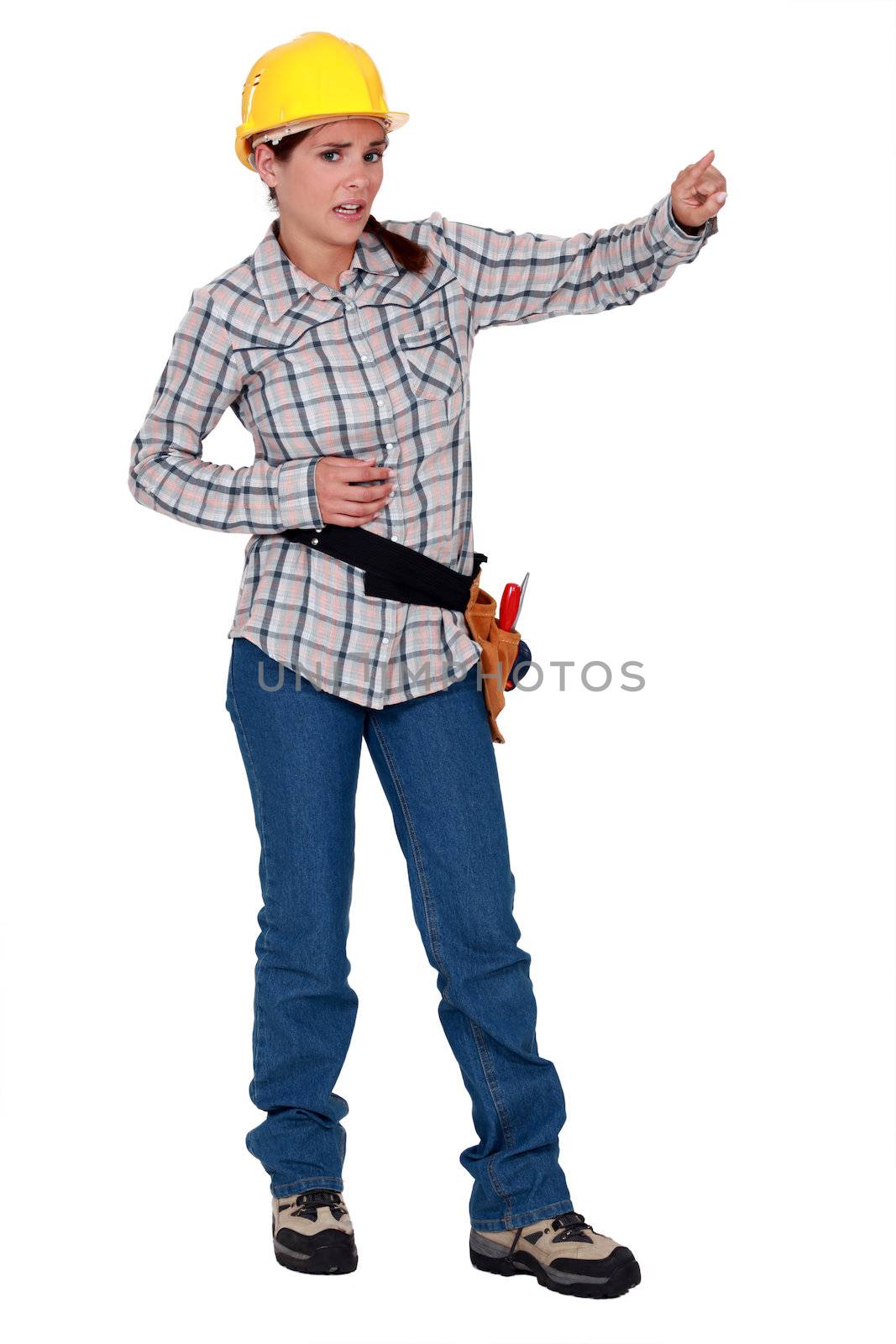 Worried construction worker pointing by phovoir