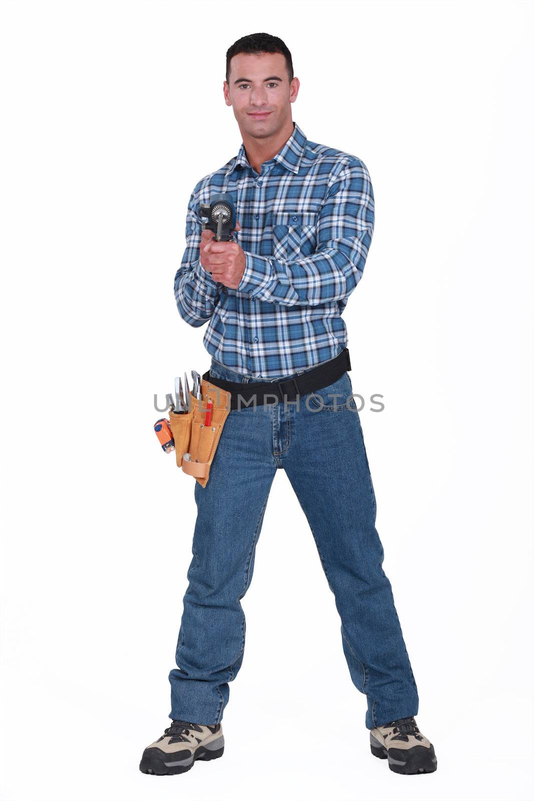 Handyman holding a cordless powerdrill