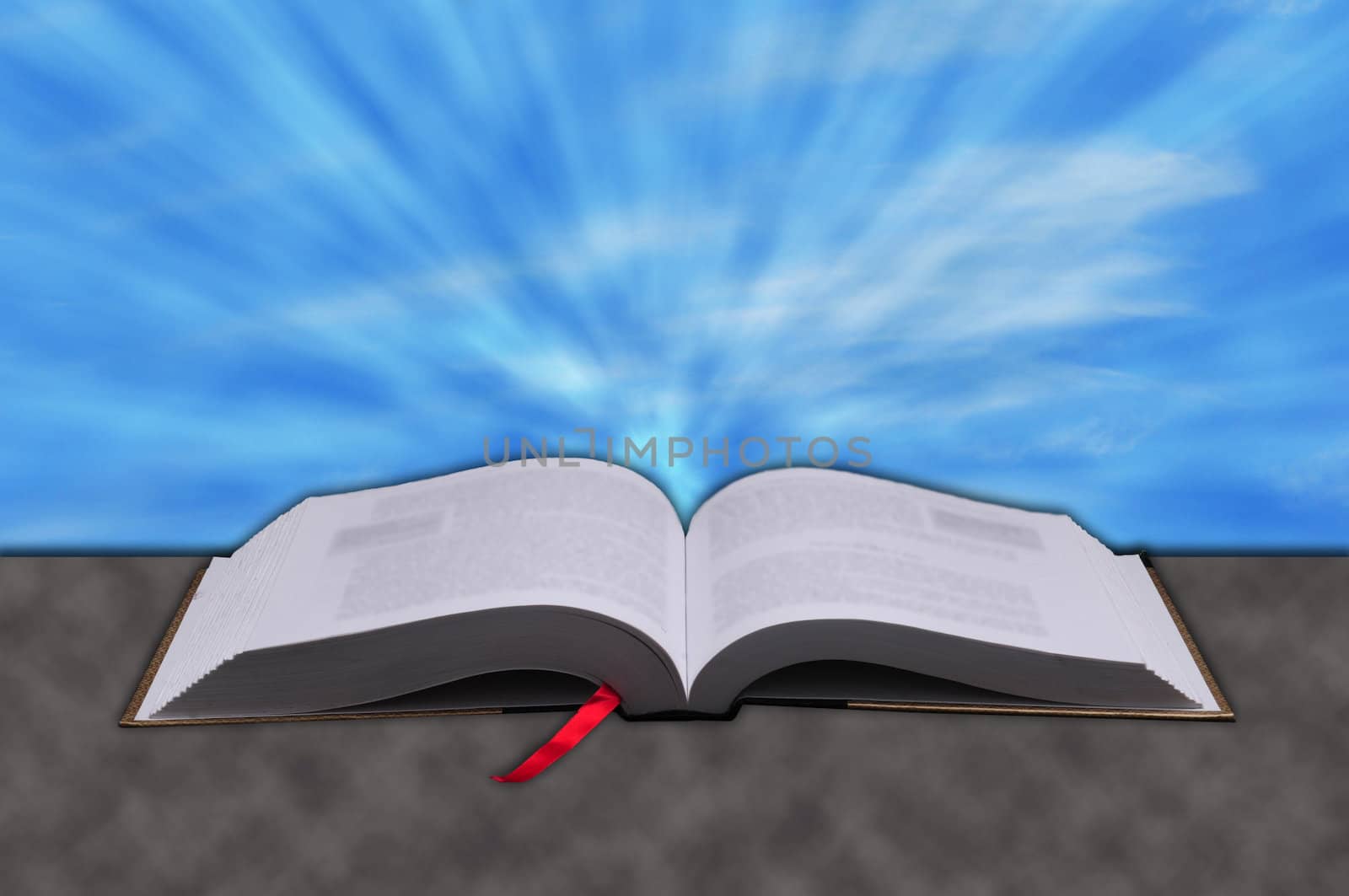 Concept of Sun rays shining down from heaven on a Christian bible
