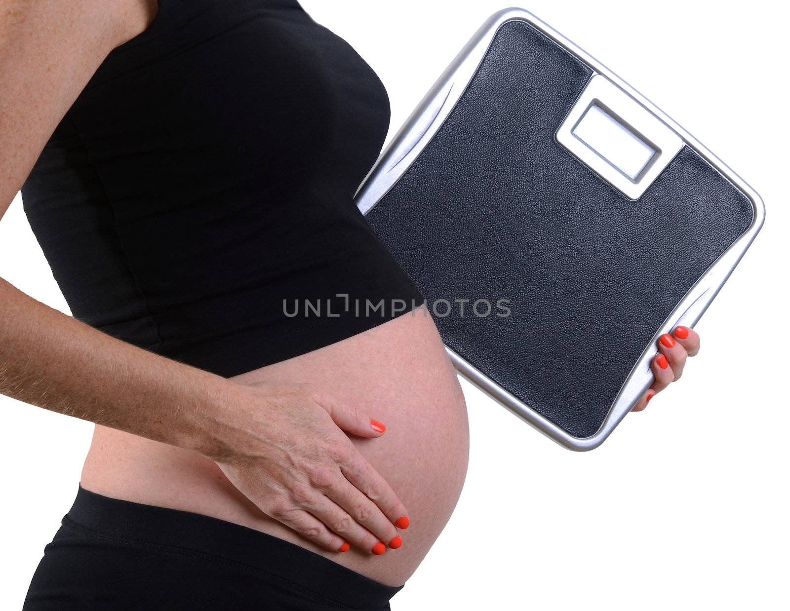 weight gain during pregnancy with pregnant woman holding scale