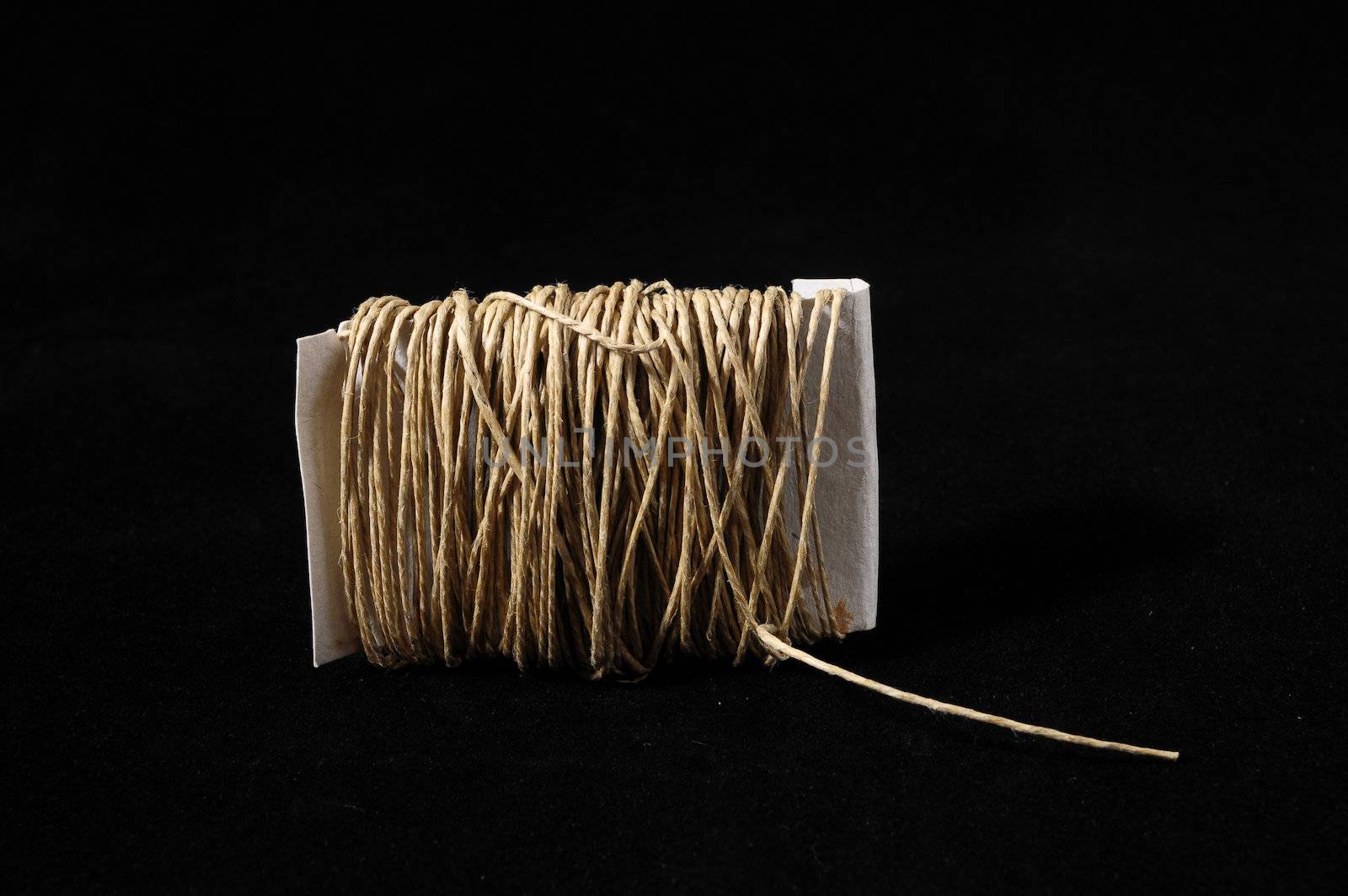 Roll of Twine isolated on a Black Background