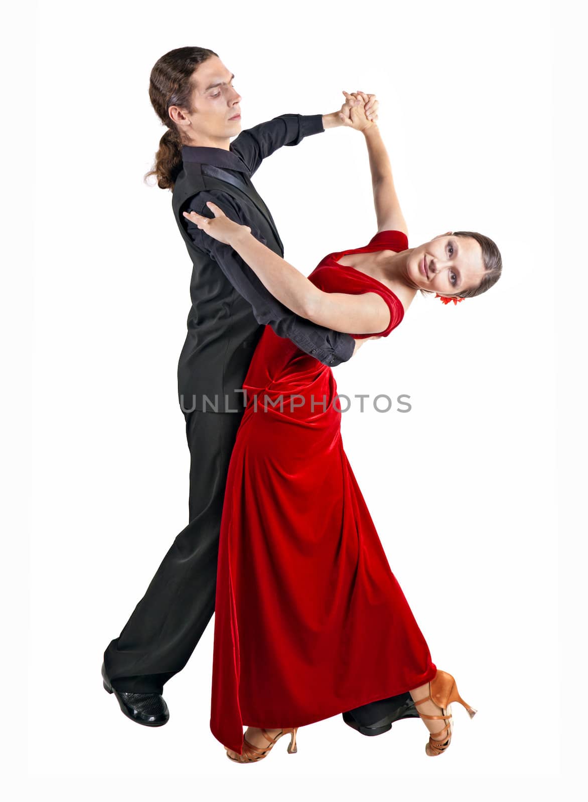 Young couple dancing waltz isolated over white background