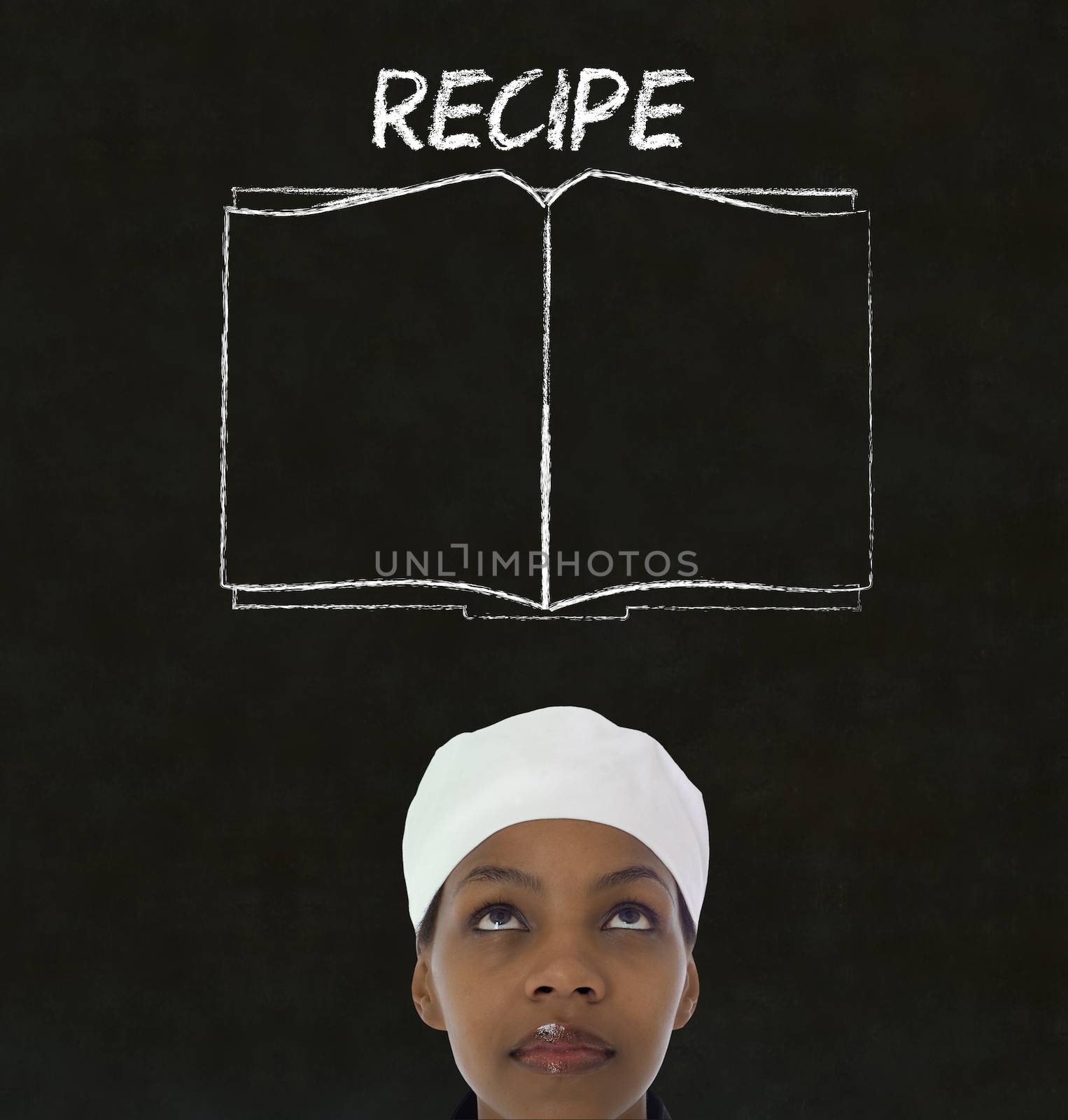 Chef with recipe book on chalk blackboard menu background by alistaircotton