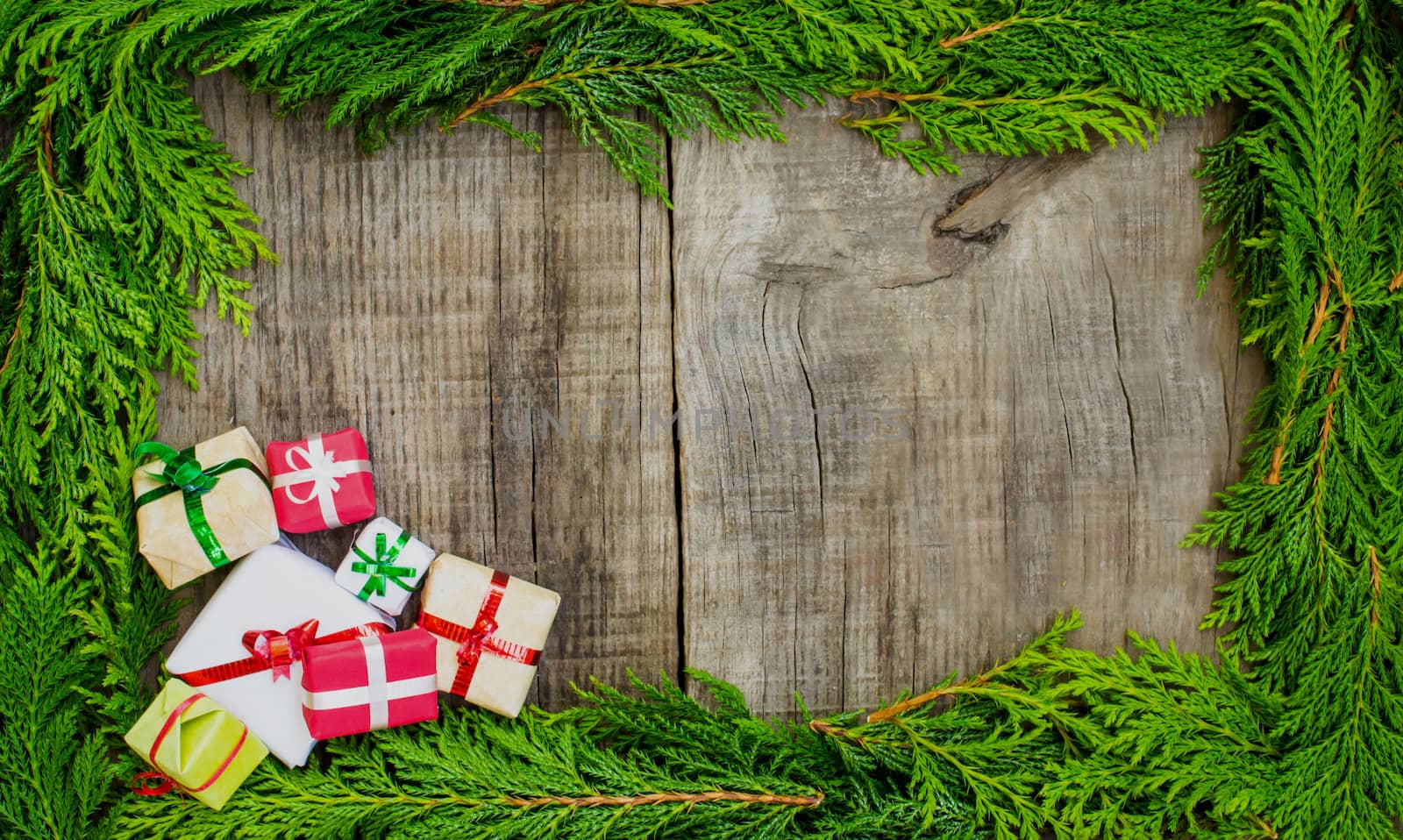 A christmas frame concept with presents on wood background