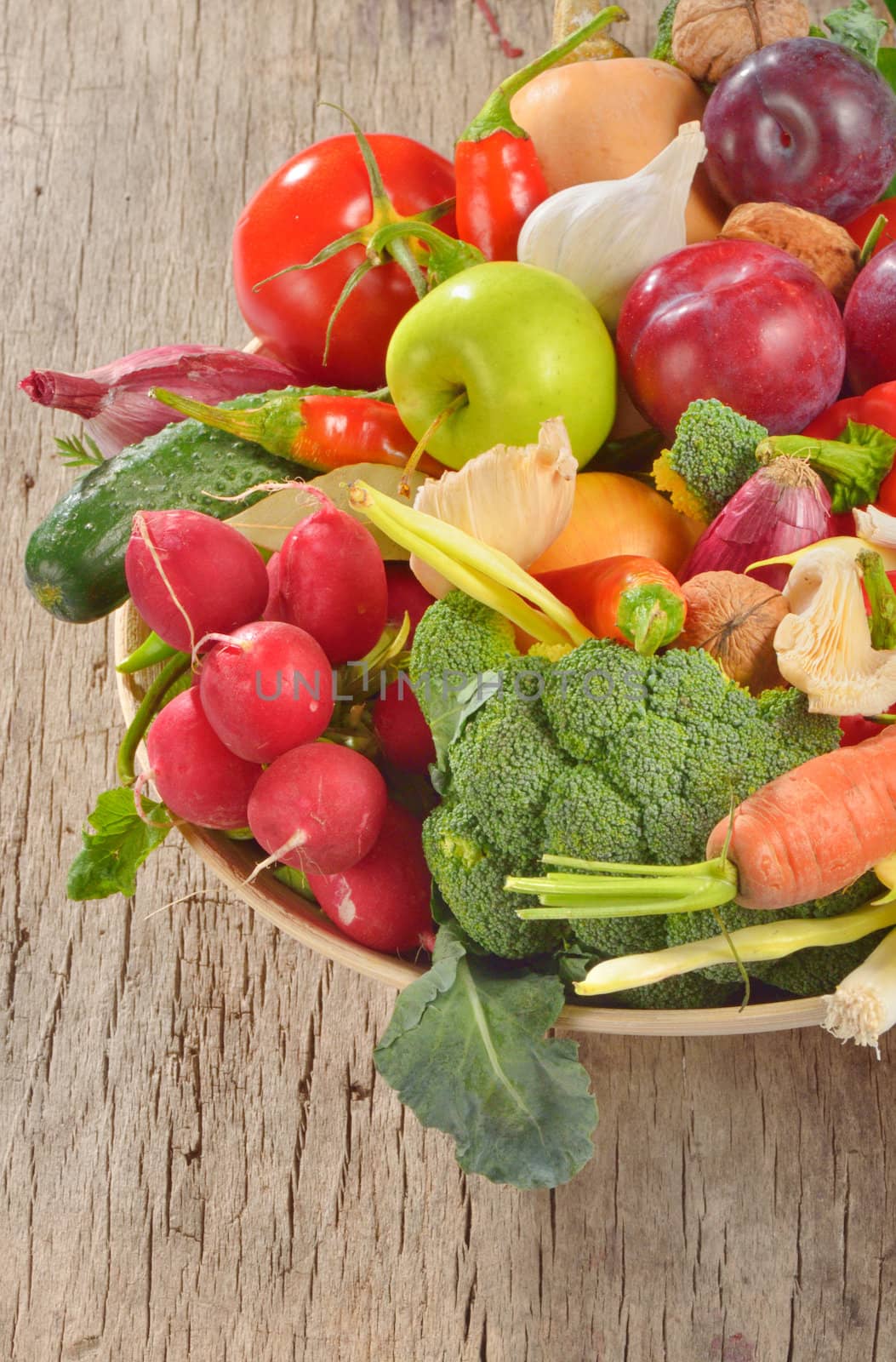 fresh fruits and vegetables on wooden table