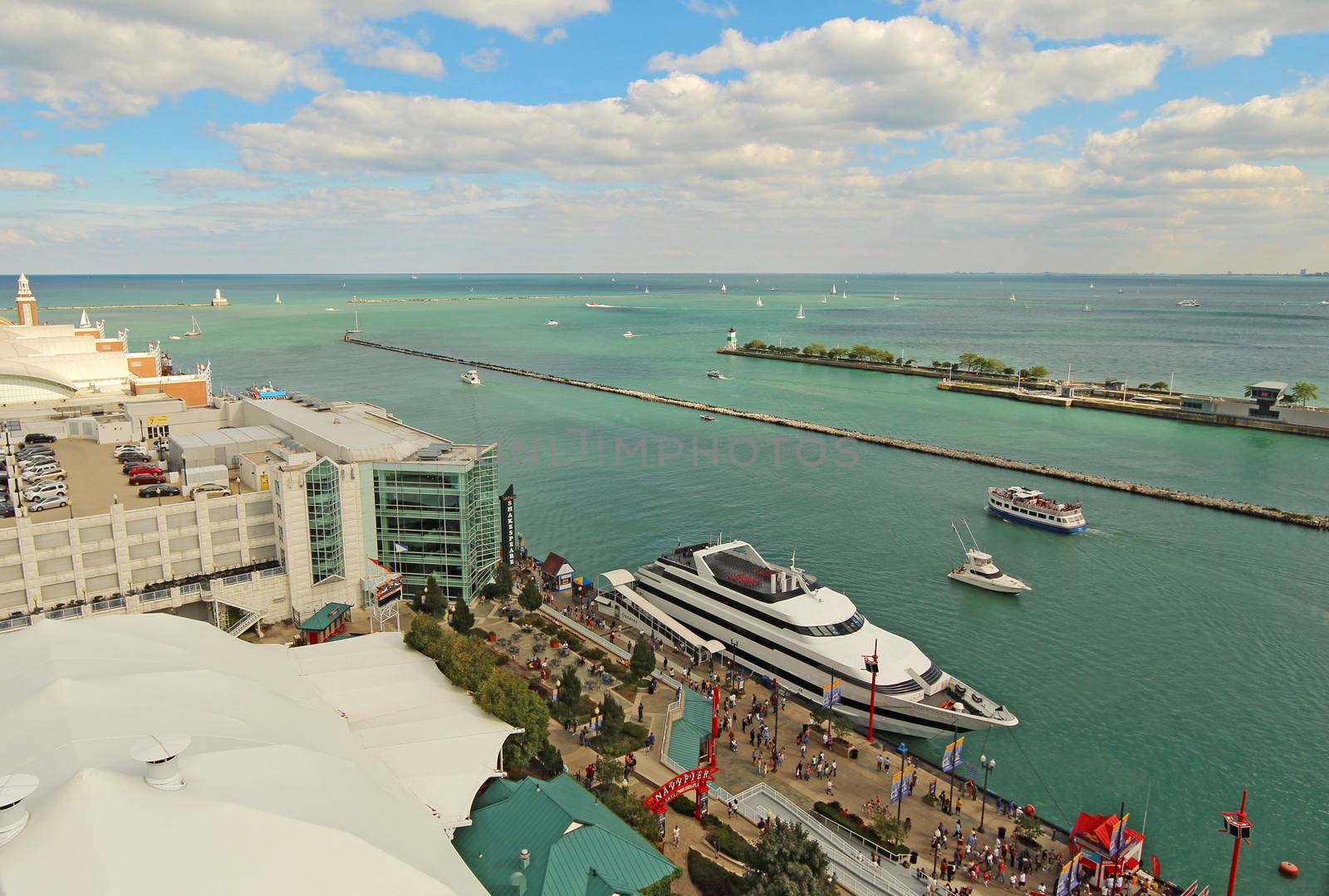 Tourists and cruise ships at Navy Pier in Chicago, Illinois by sgoodwin4813